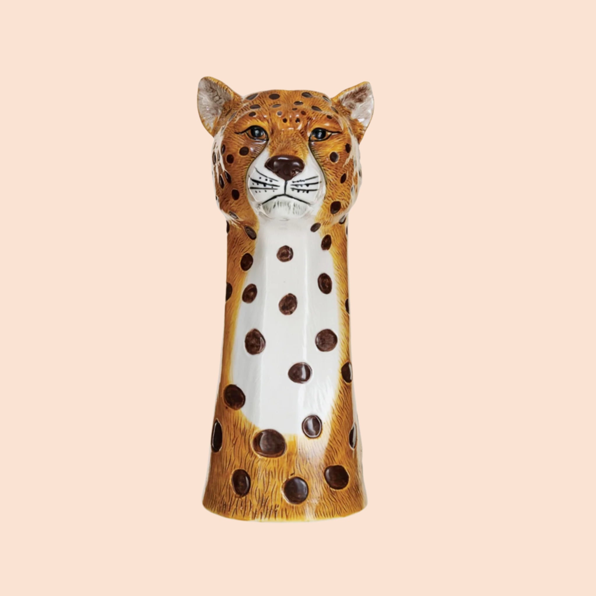 A cheetah head shaped ceramic vase with an opening at the top for an arrangement. 