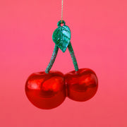 A glass cherry shaped ornament. 