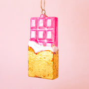 A pink and gold glass shaped chocolate bar with the loop for hanging. 