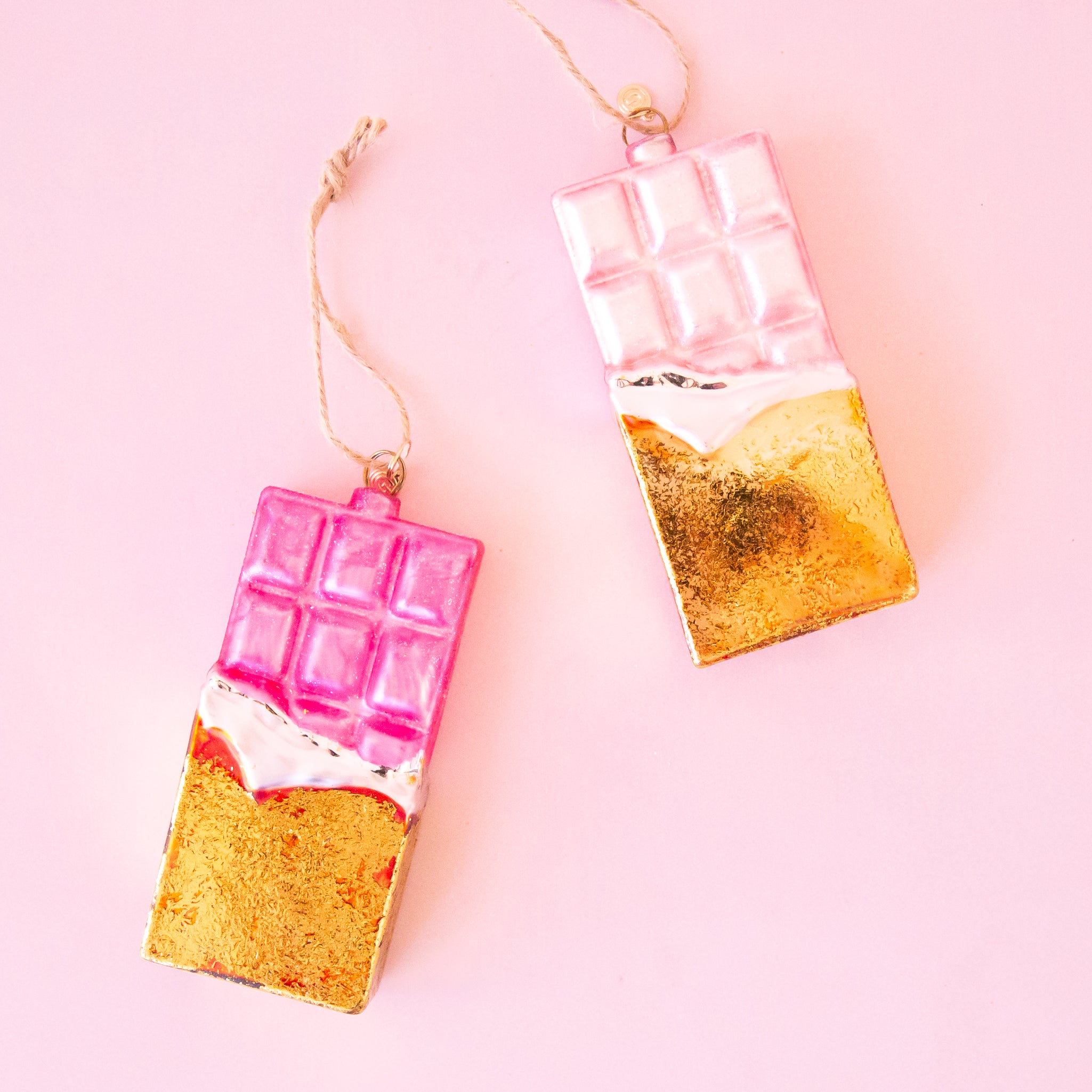 A pink and gold glass shaped chocolate bar with the loop for hanging. 