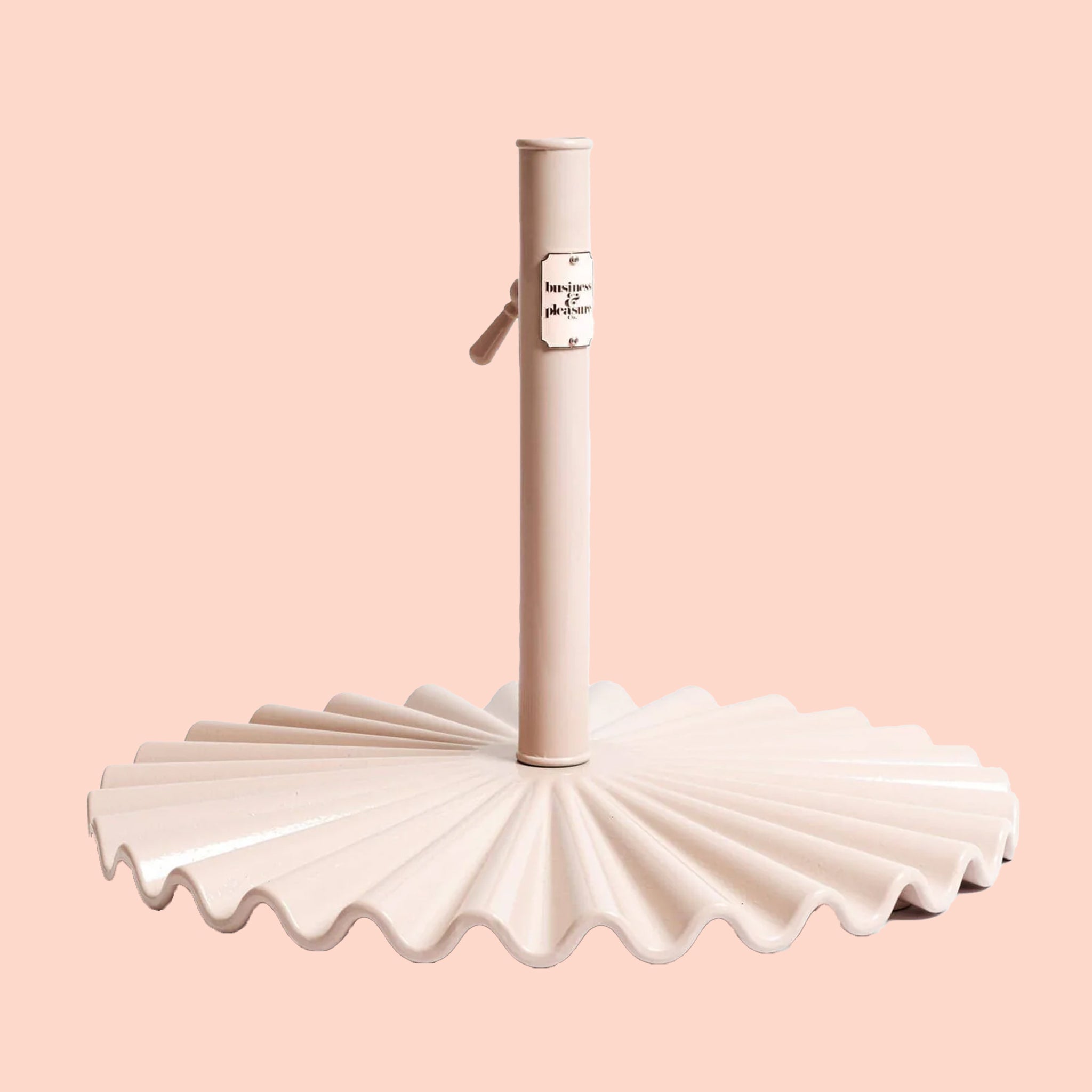 A light pink clamshell umbrella base. 