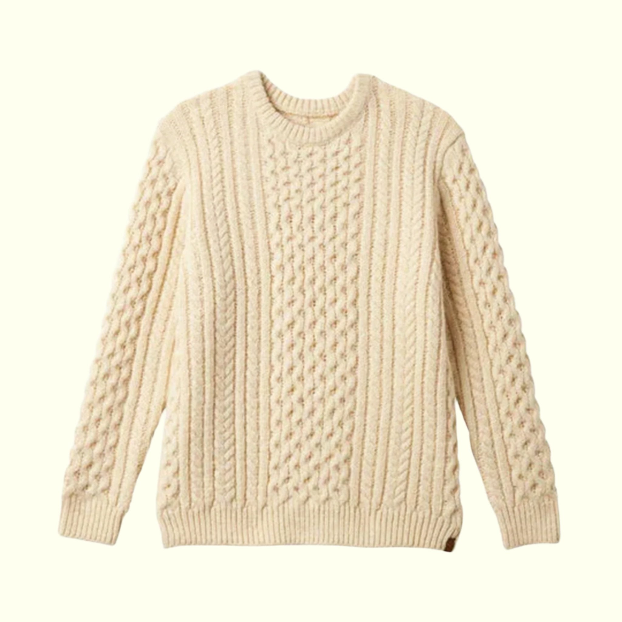 A neutral cable knit sweater in an oatmeal shade. 