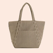 A brown stripe tote bag with a shoulder strap. 