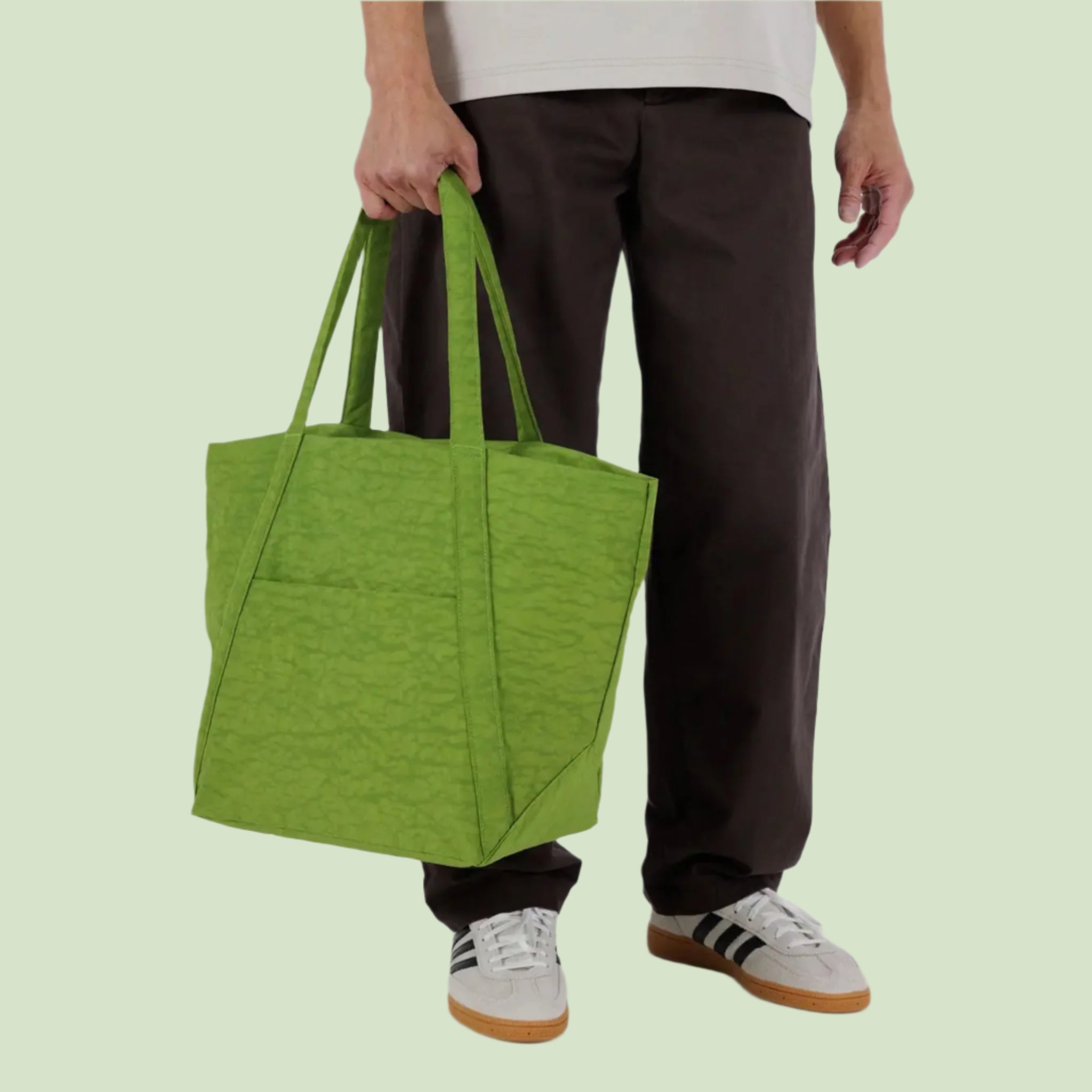 A green puffer tote bag. 