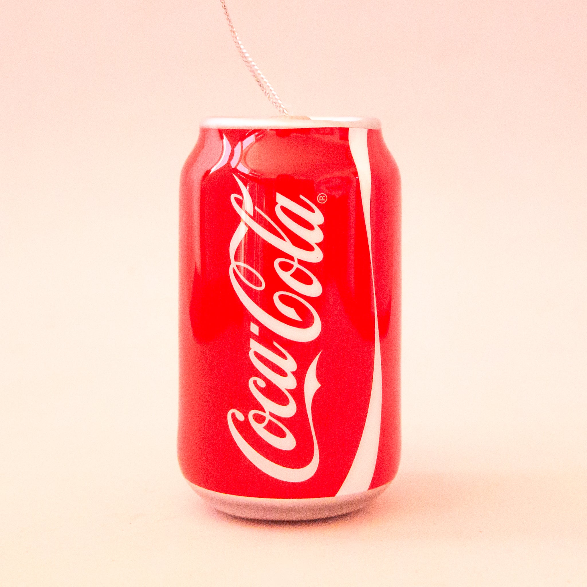 A coca cola can shaped ornament. 