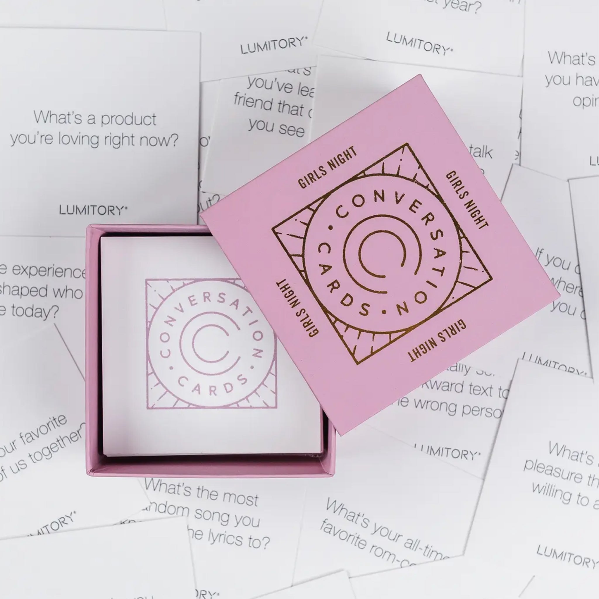 A pink box of conversation cards geared towards girls nights. 
