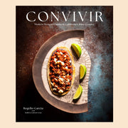 A black, brown and blue book cover with a plate of Mexican cuisine and white text above that reads, 'Convivir'.  