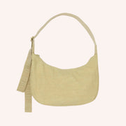 A crescent shaped nylon handbag with an adjustable strap. 