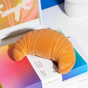 A croissant shaped velvet storage box for jewelry nicknacks and more. 