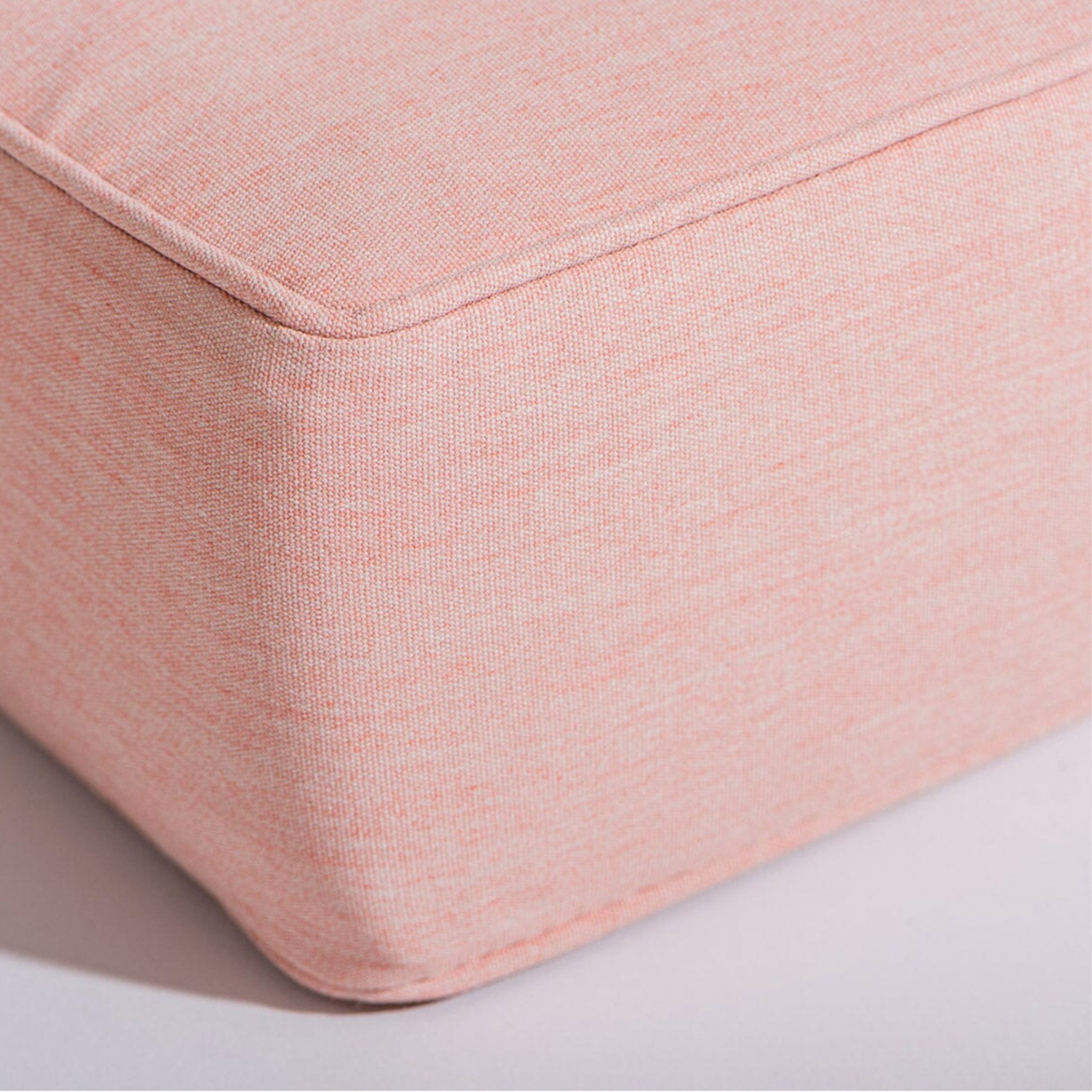 A pink lounge chair cushion. White chair base not included with purchase.