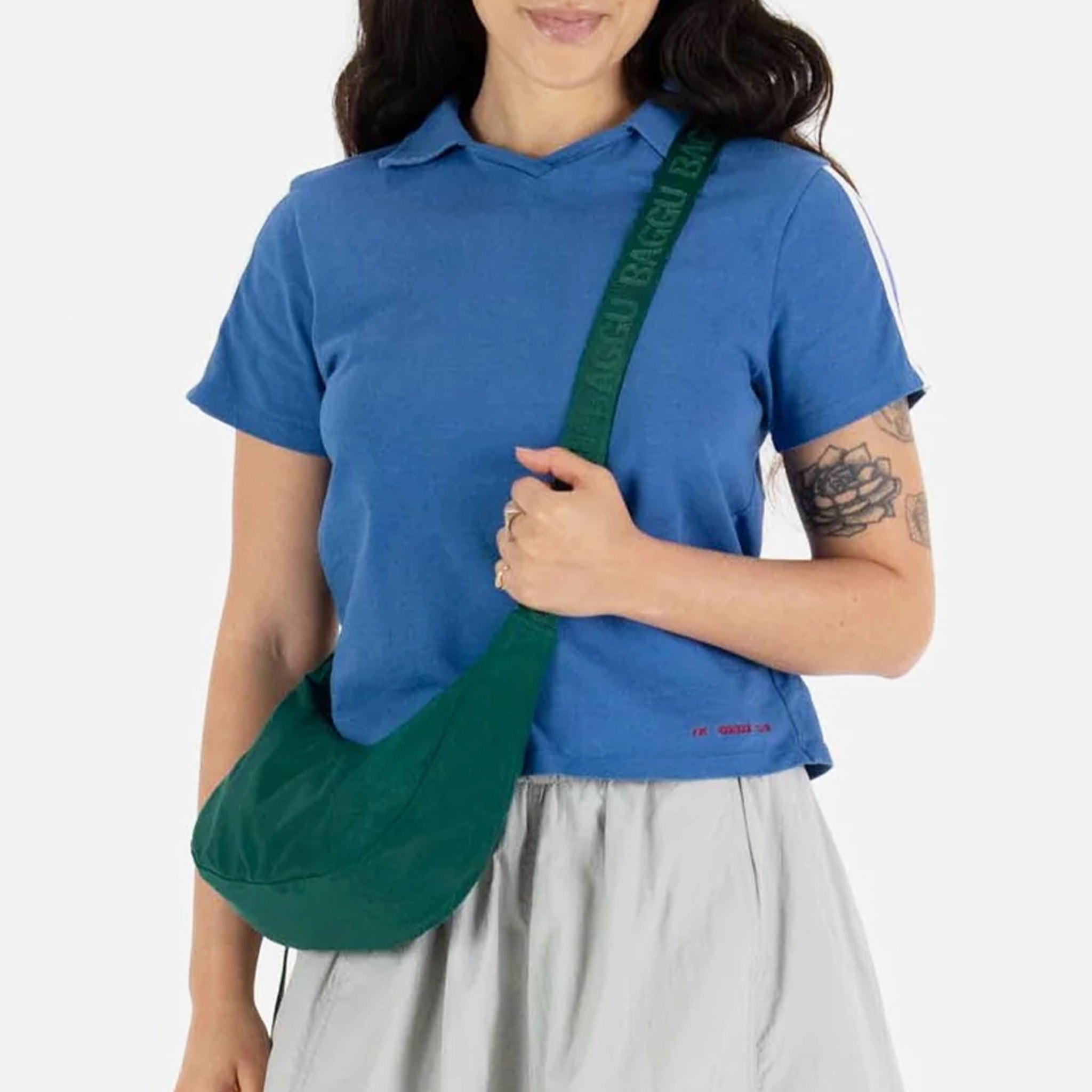 A green nylon shoulder / crossbody handbag with an adjustable strap.
