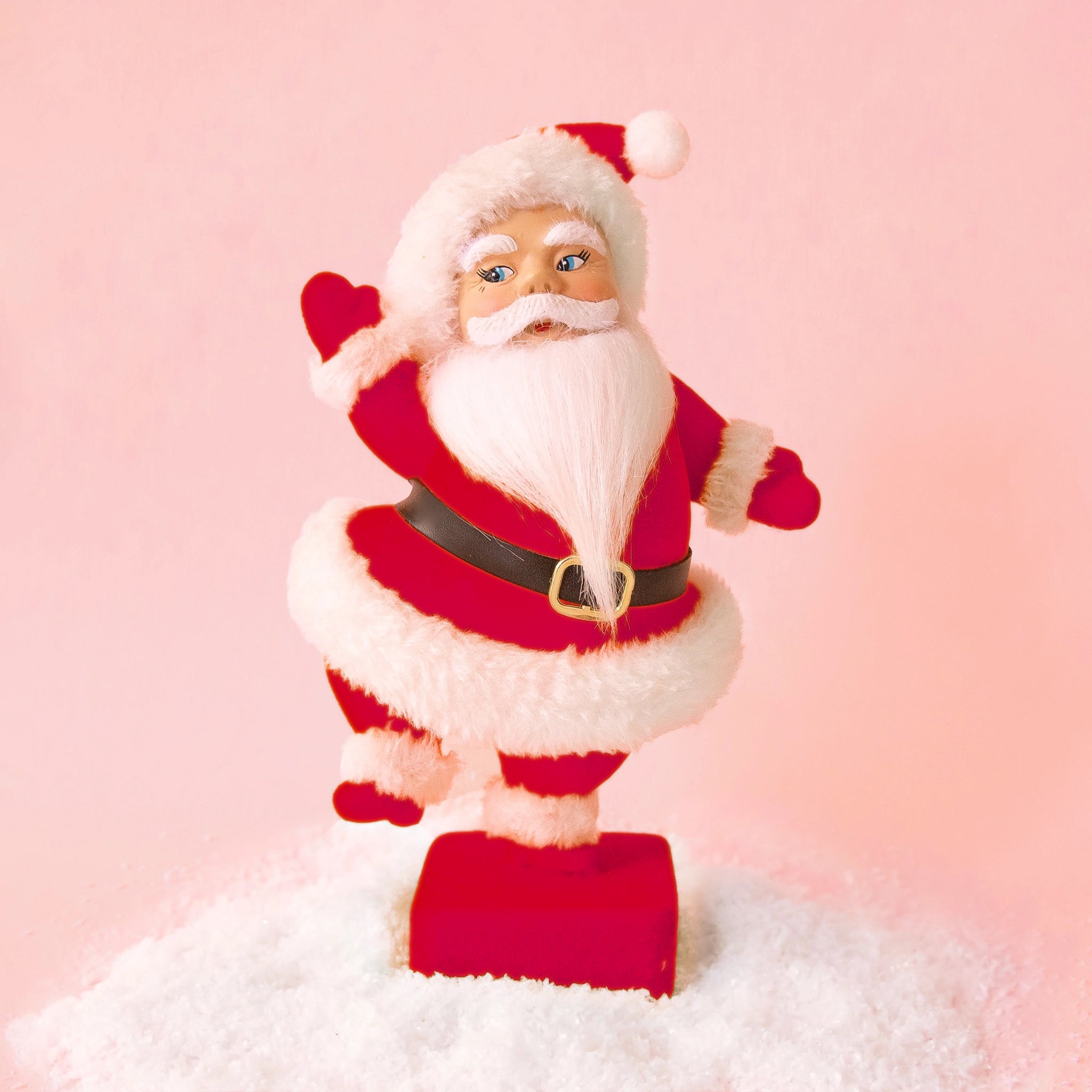 A red and white Santa figurine. 