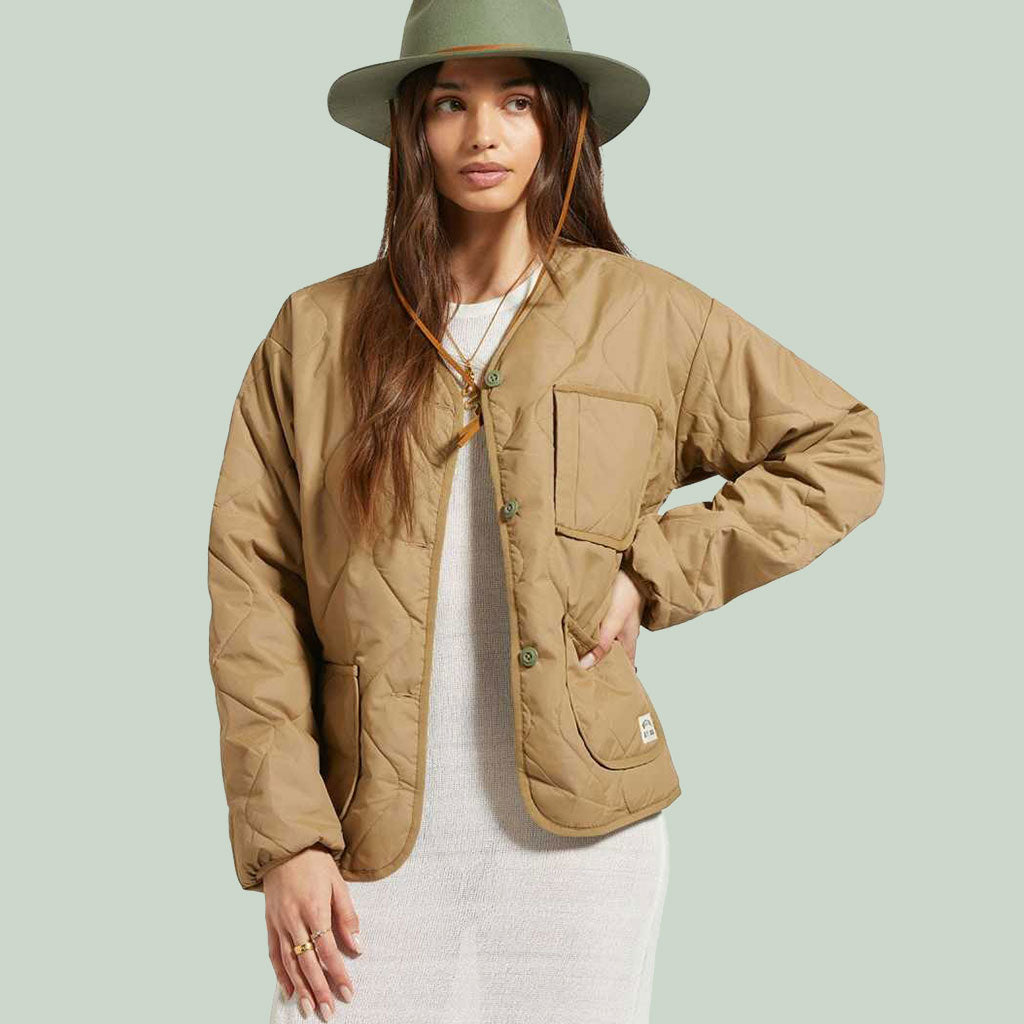 woman wearing light brown quilted jacket