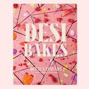 A pink book cover text that reads, 'Desi Bakes'.