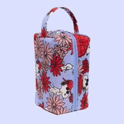 A blue dopp kit with a red and pink floral snoopy print.