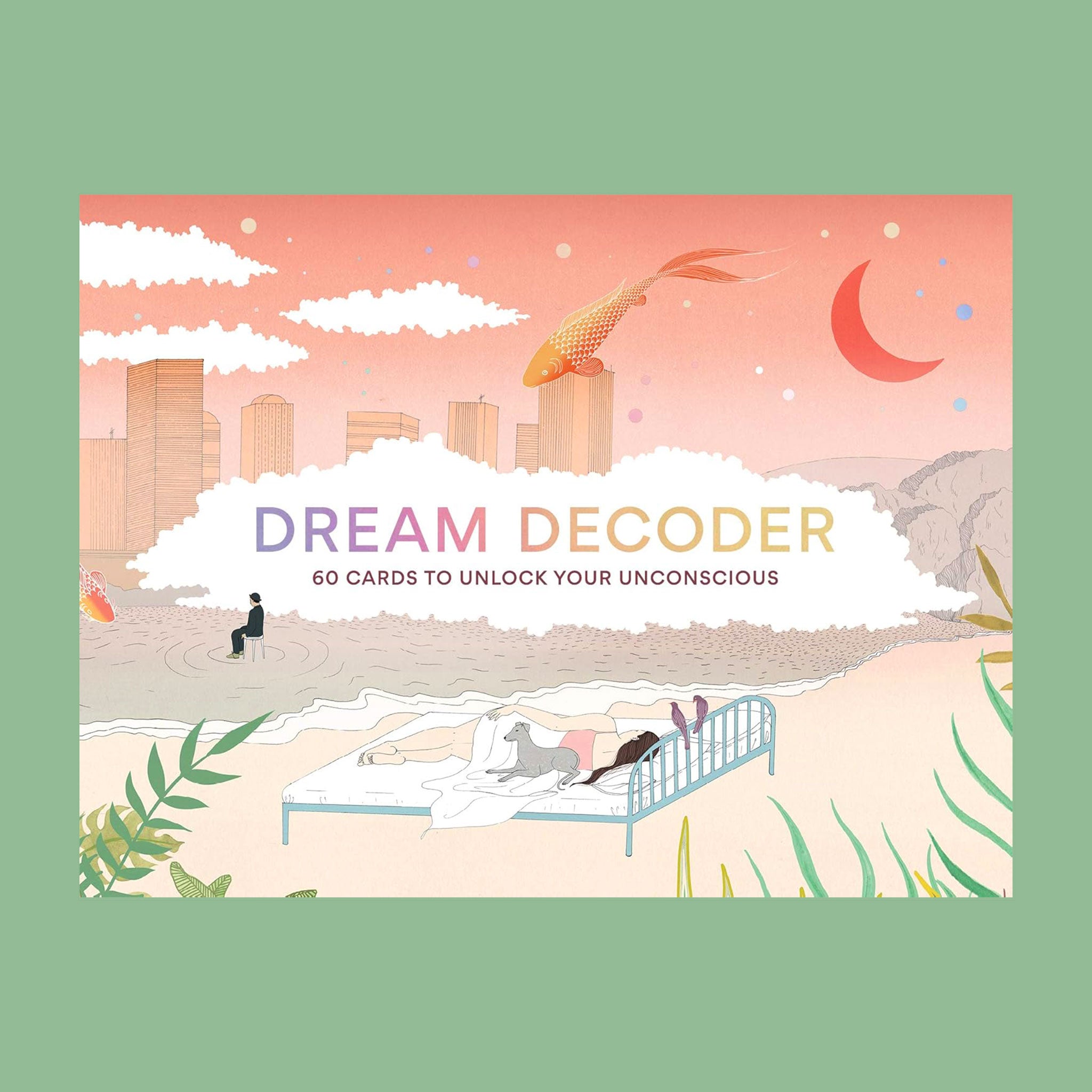 A box with dreamy graphics of the sky and a city with clouds and a bed on the beach. Also photographed are the cards inside of the box that have illustrations of different dream scenarios along with words on the back describing their meaning.