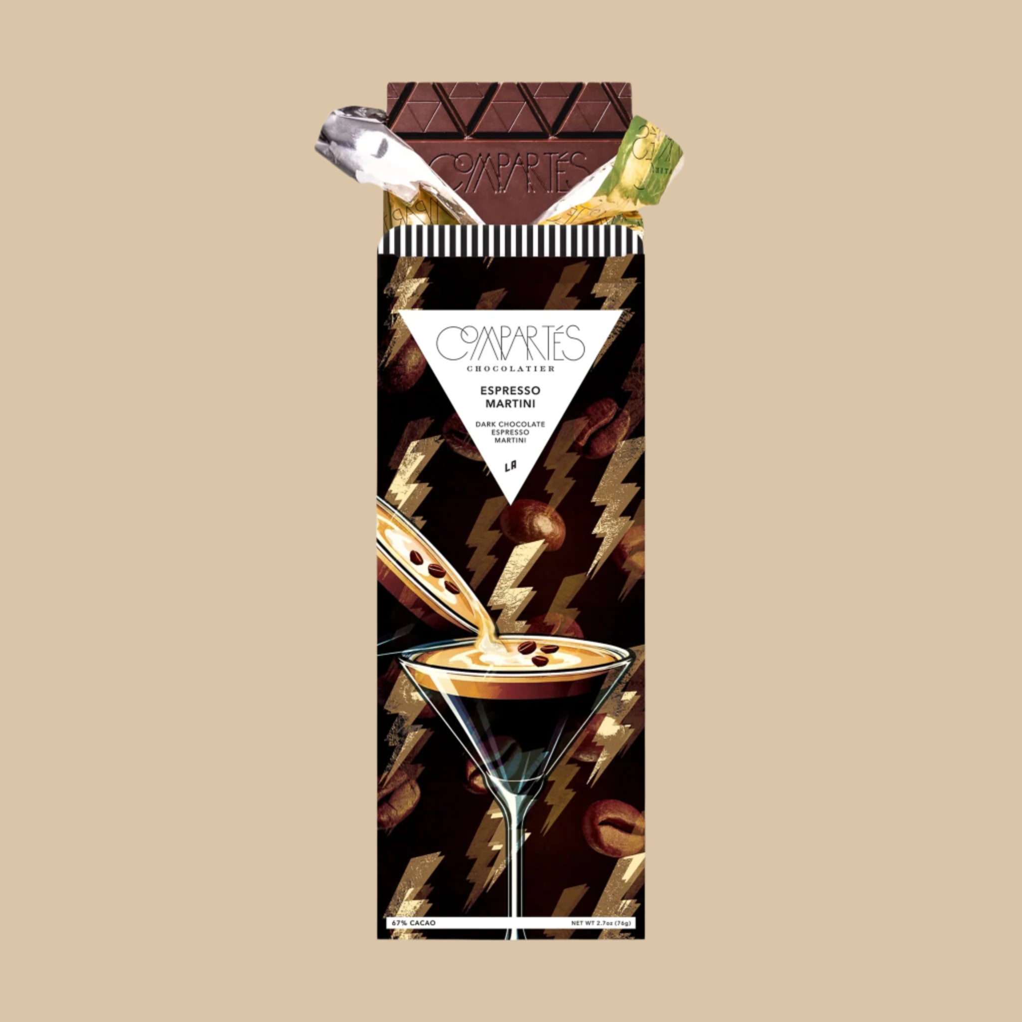 A chocolate bar wrapped in a brown packaging with lightening bolts and espresso martini graphics along with text that reads, 'Compartes Chocolate Espresso Martini'. 