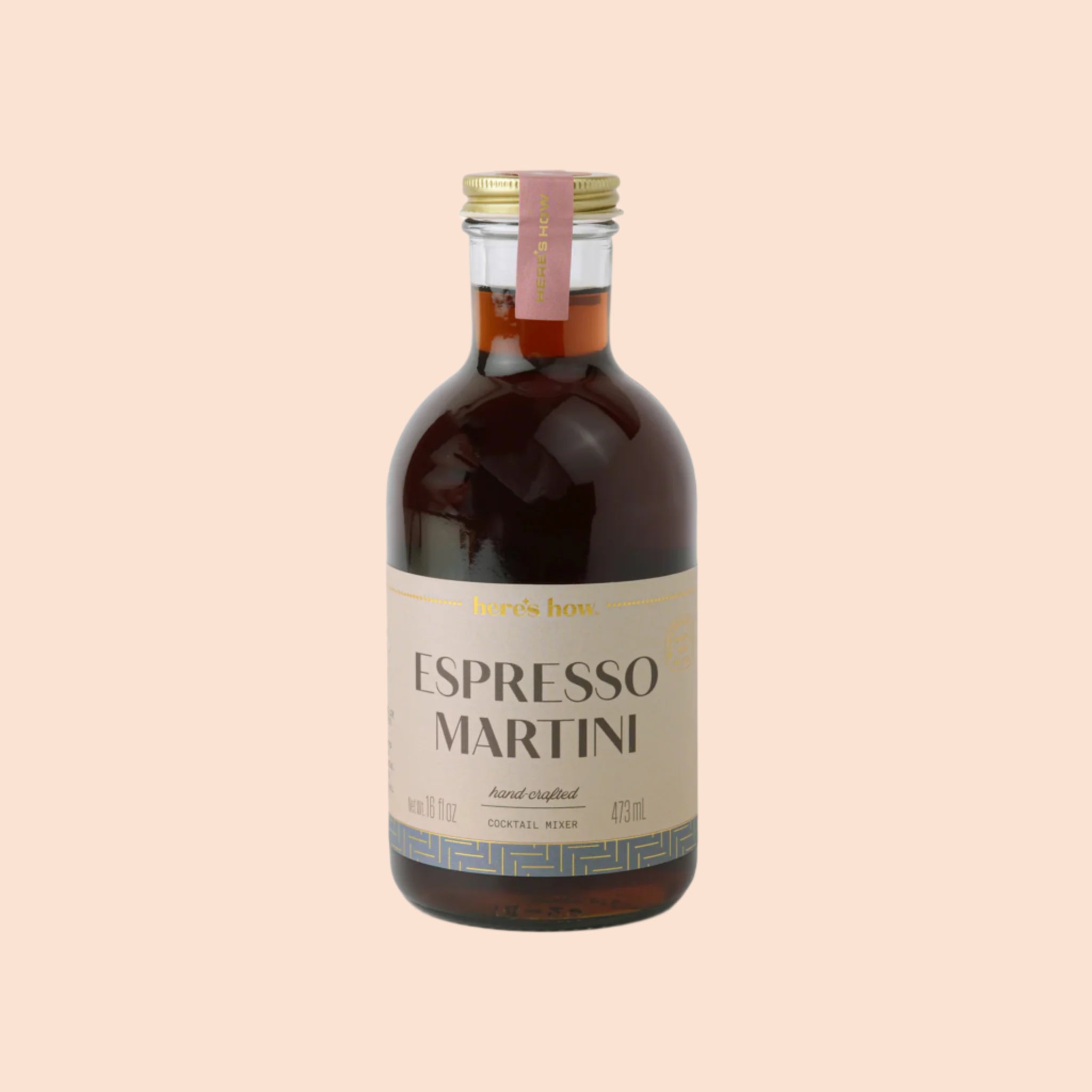 A glass bottle of espresso martini cocktail mix with text that reads, &#39;Espresso Martini&#39;. 