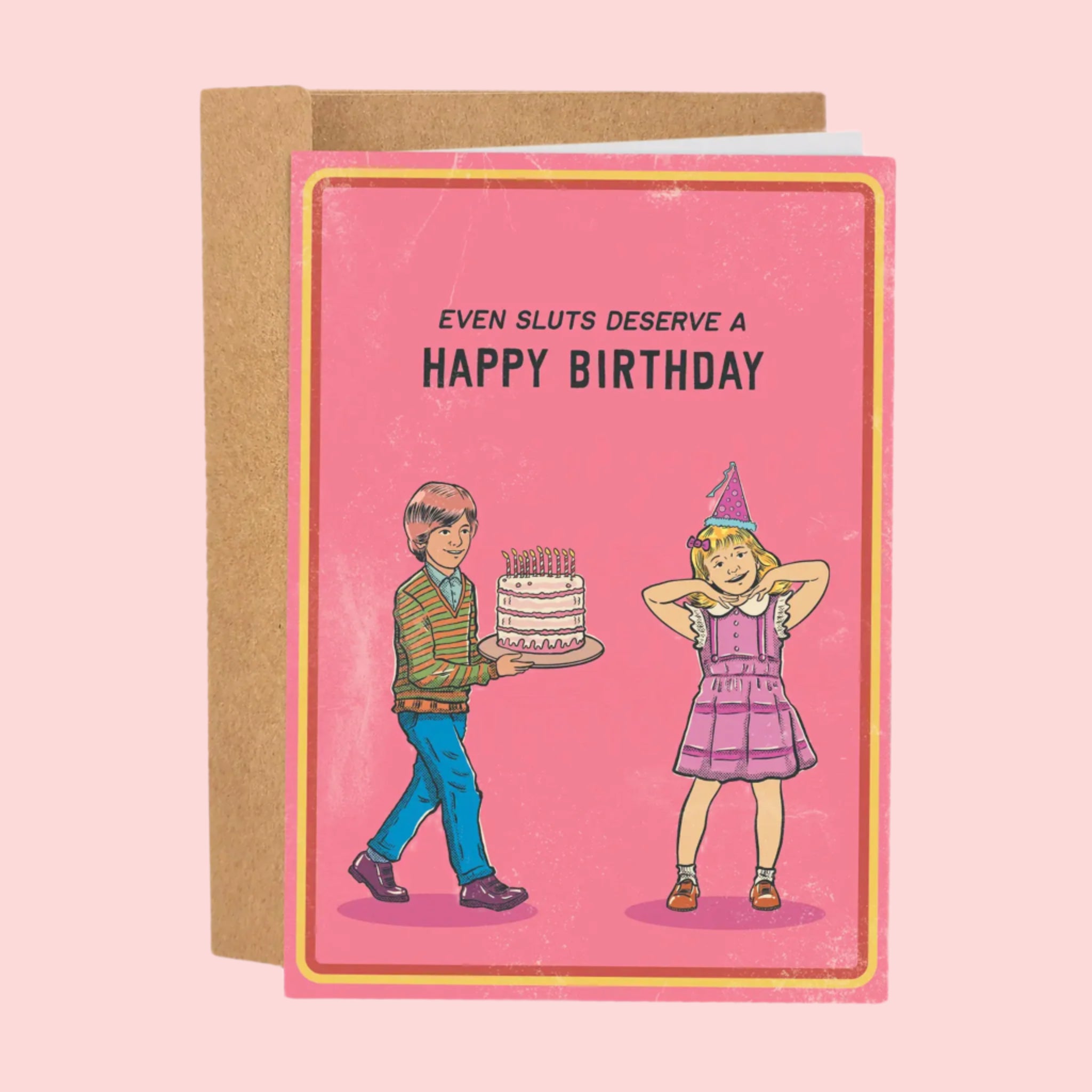 A pink card with text that reads, &#39;Even sluts deserve a Happy Birthday&#39; with an illustration of a boy bringing out a birthday cake to a girl with a pink birthday outfit and hat on. 