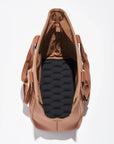 On a white background is a brownish/tan tote bag for carrying pets with two straps and a padded black bottom. 