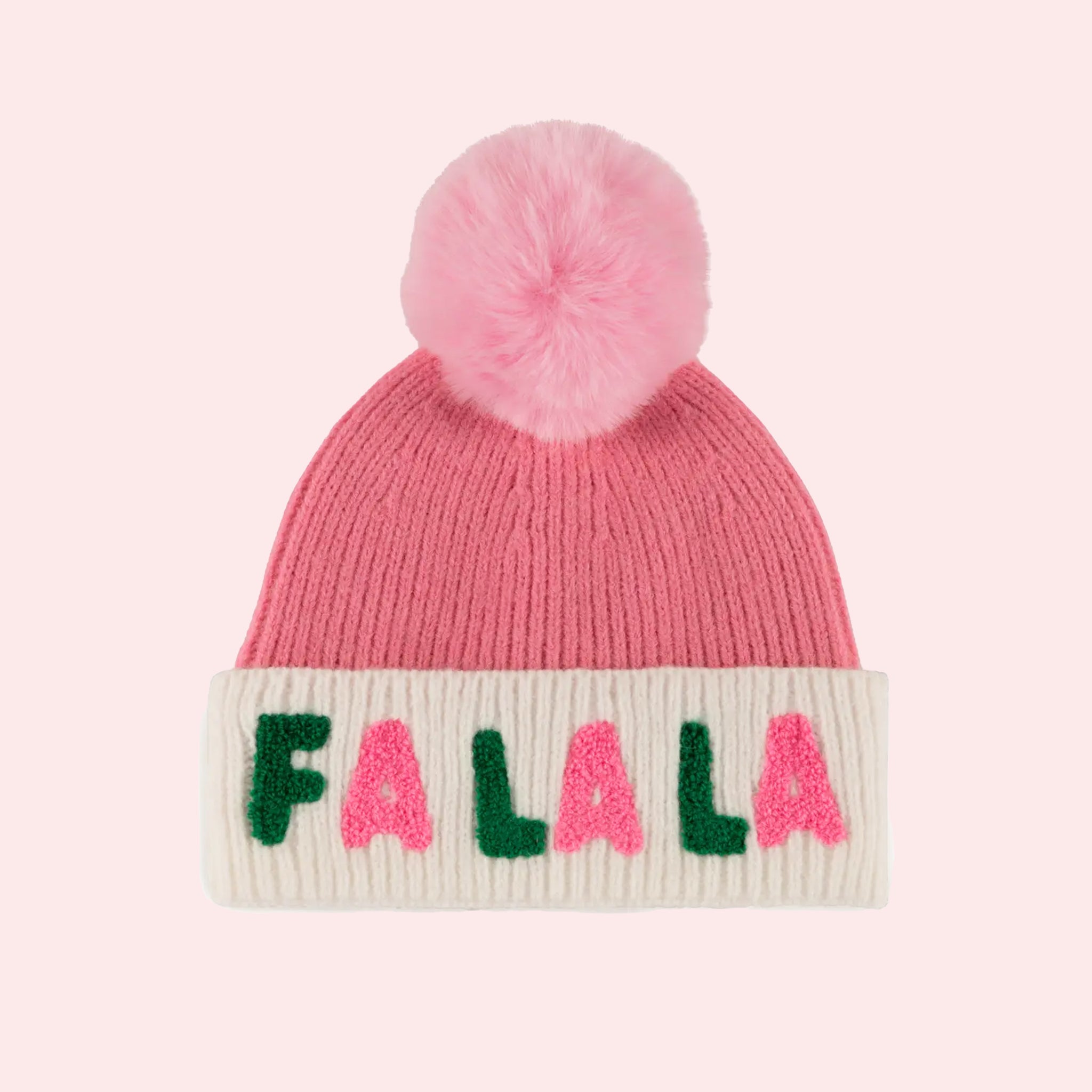 A pink and green beanie with a pink pom pom at the top and text around the base that reads, &#39;Fa La La&#39;. 