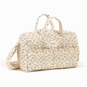 A light tan leopard print baby doll diaper bag. 