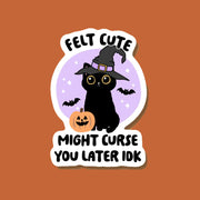 An orange, purple and black sticker with a black cat design and text that reads, "Felt Cute Might Curse You Later Idk". 