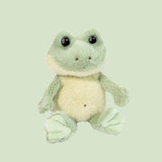 A fuzzy frog shaped stuffed animal. 