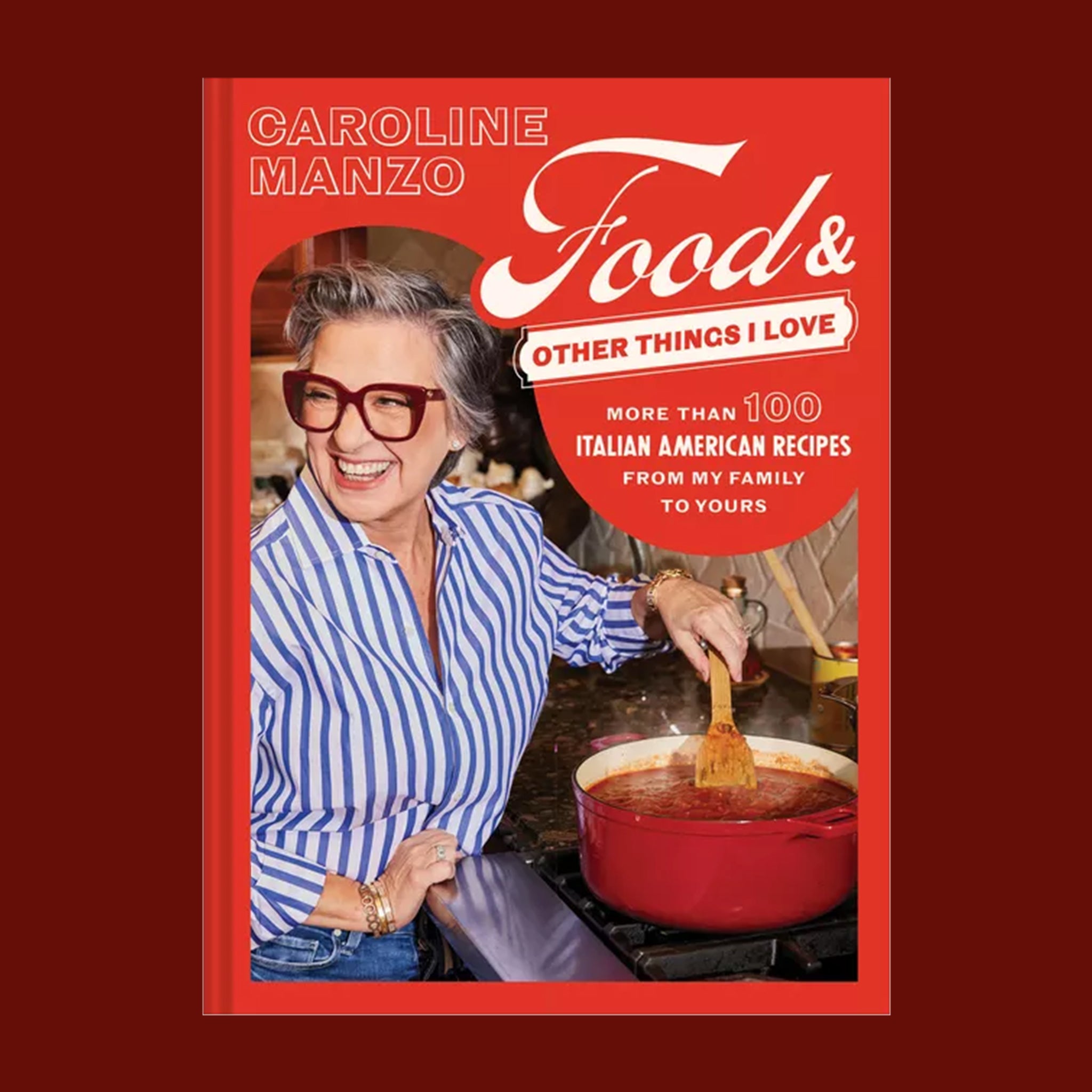 A red cook book with a photo of a chef stirring a red sauce and text that reads, 'Food & Other Things I Love More Than 100 Italian American Recipes From My Family To Yours'. 