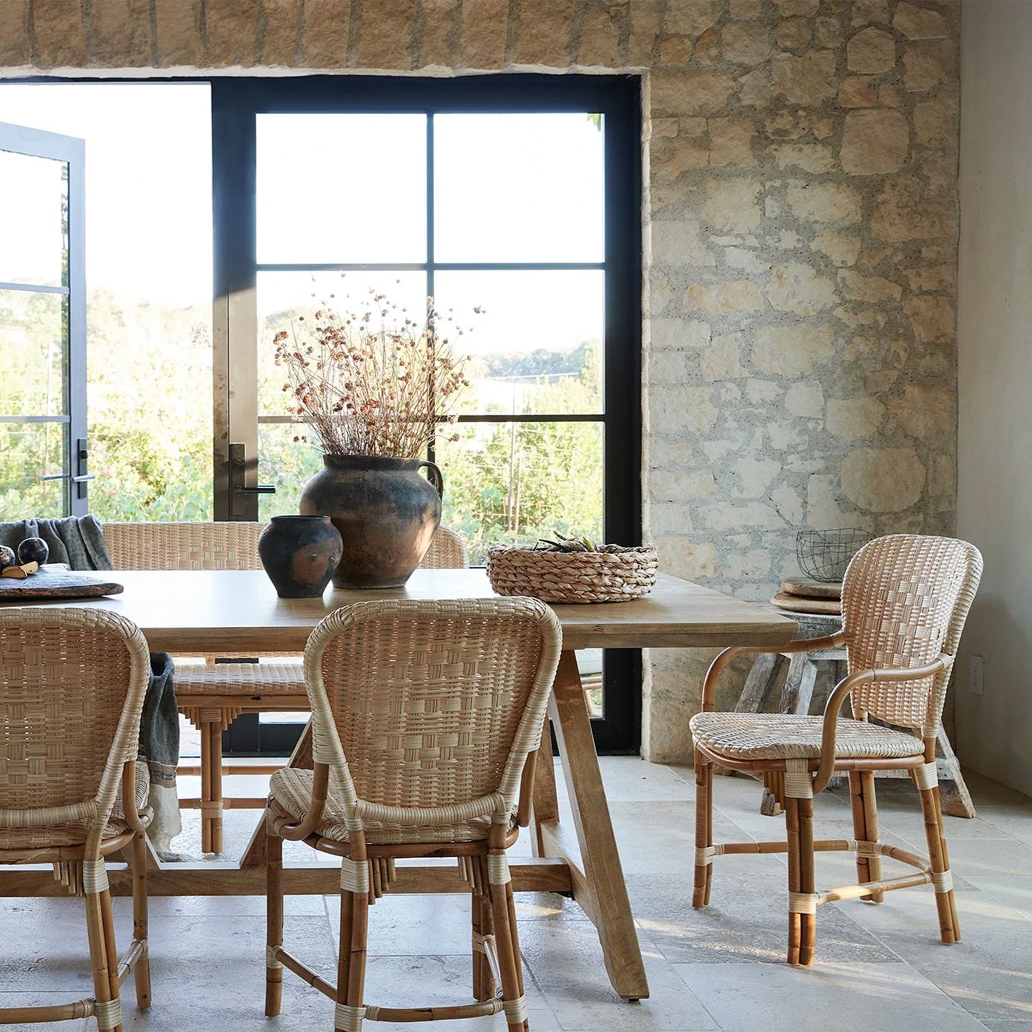 A rattan chair with a woven rattan seat and backrest.