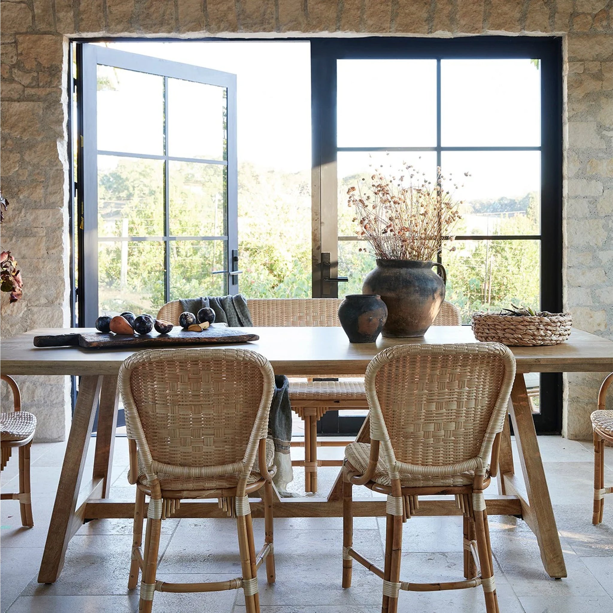 A rattan chair with a woven rattan seat and backrest.