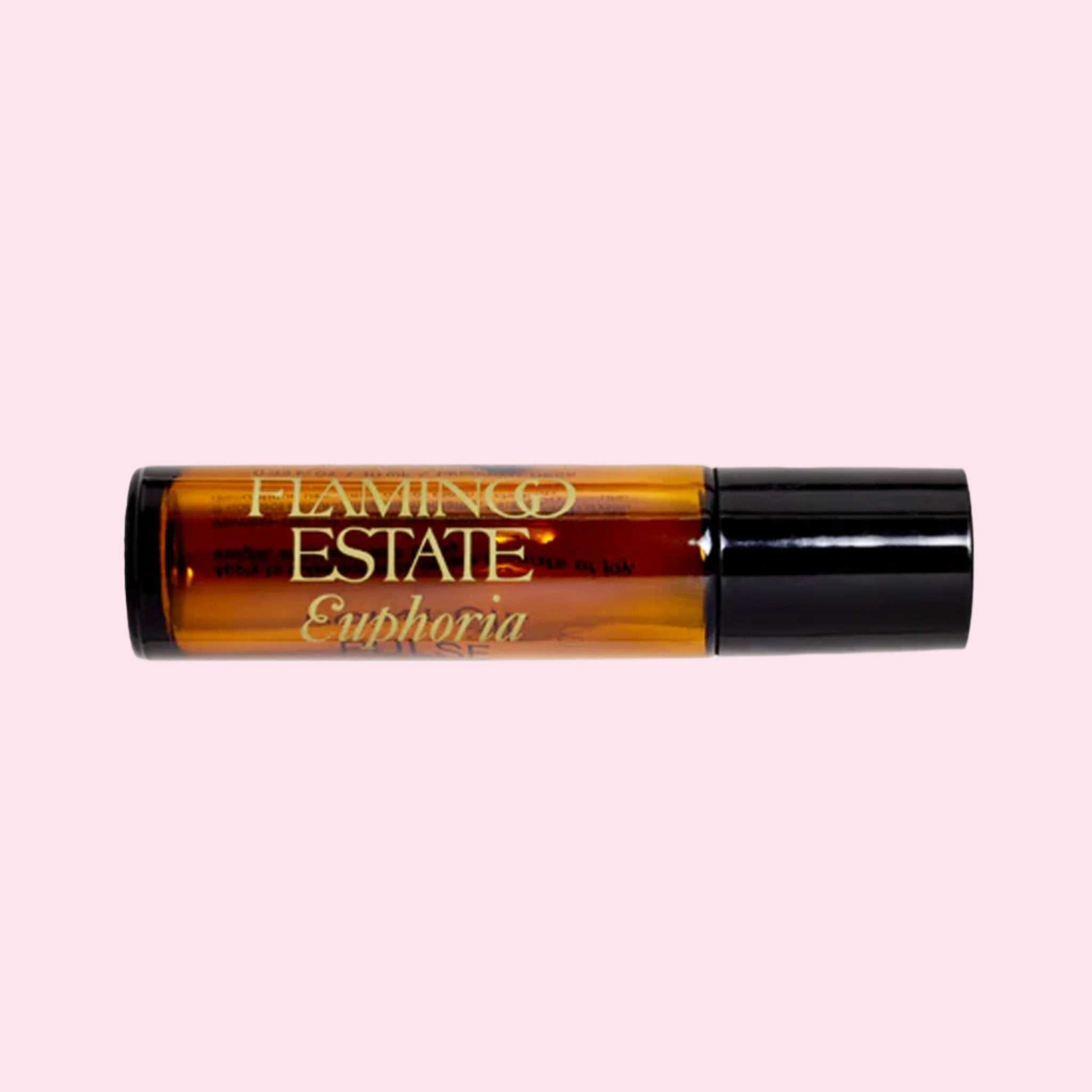 An amber roller ball fragrance oil with text that reads, 'Flamingo Estate Euphoria'. 