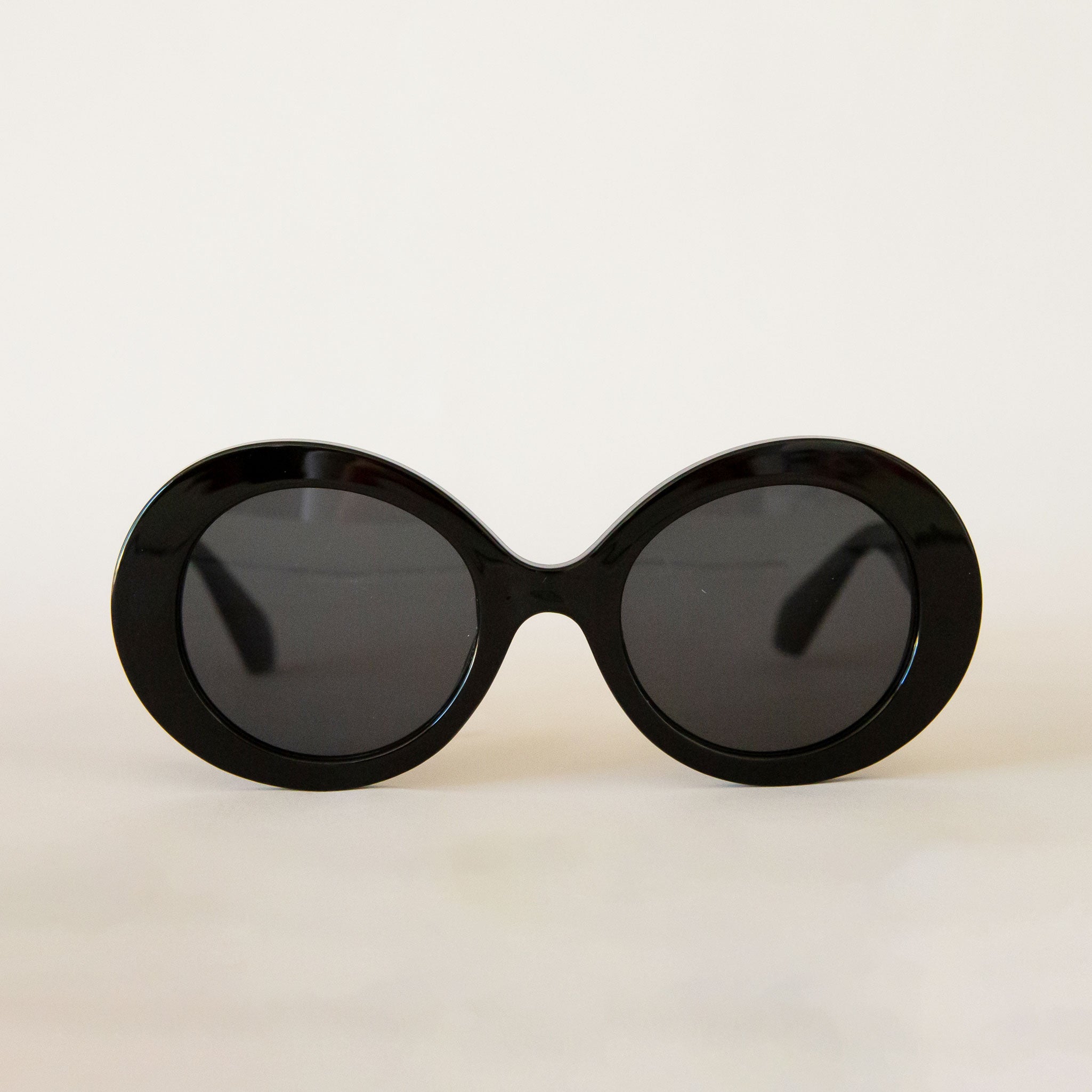 A black round pair of sunglasses. 
