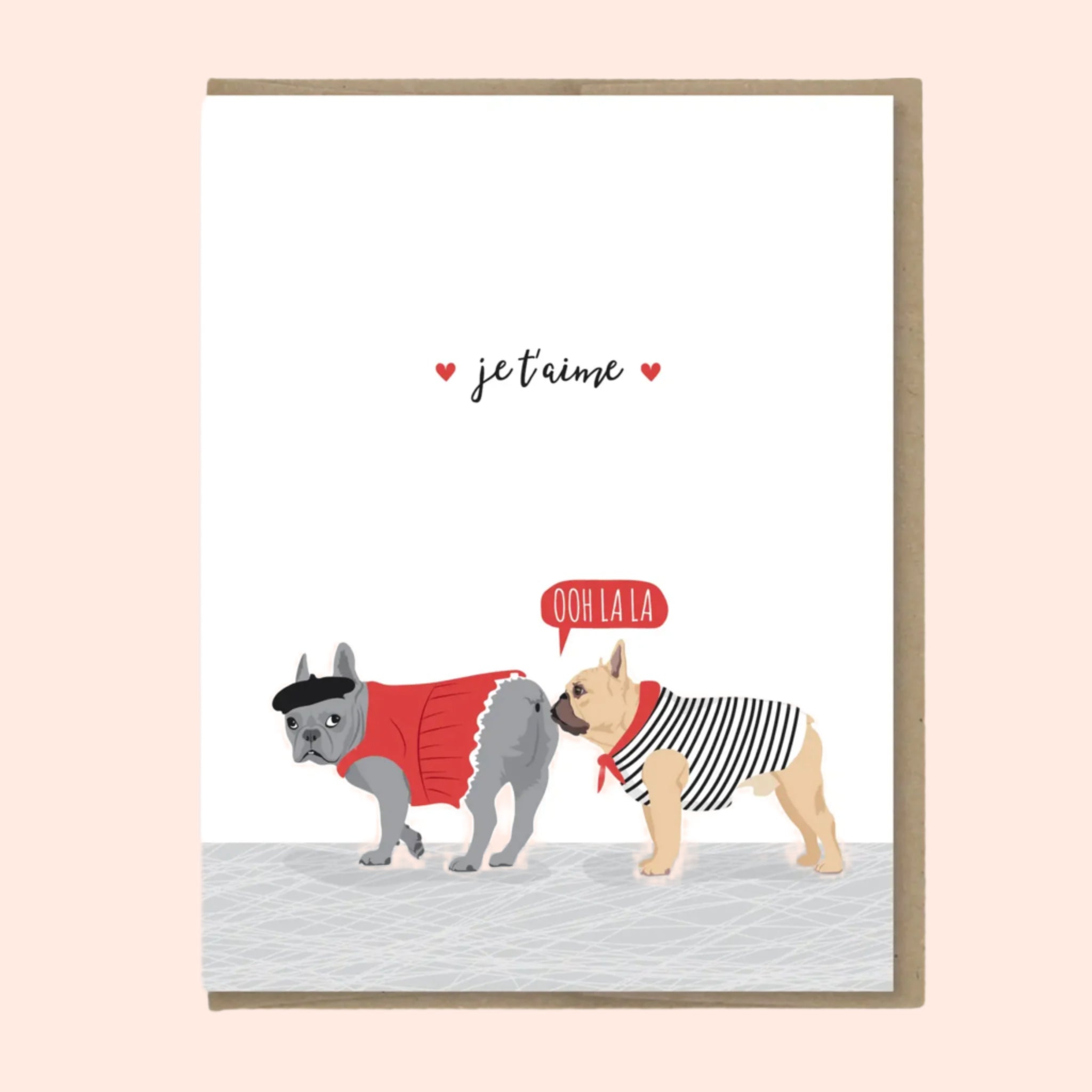 A white card that reads, 'eje t'amie' and an illustration of two French Bulldogs wearing French outfits and a speech bubble above the one sniffing the other that reads, 'Ooh La La'. 