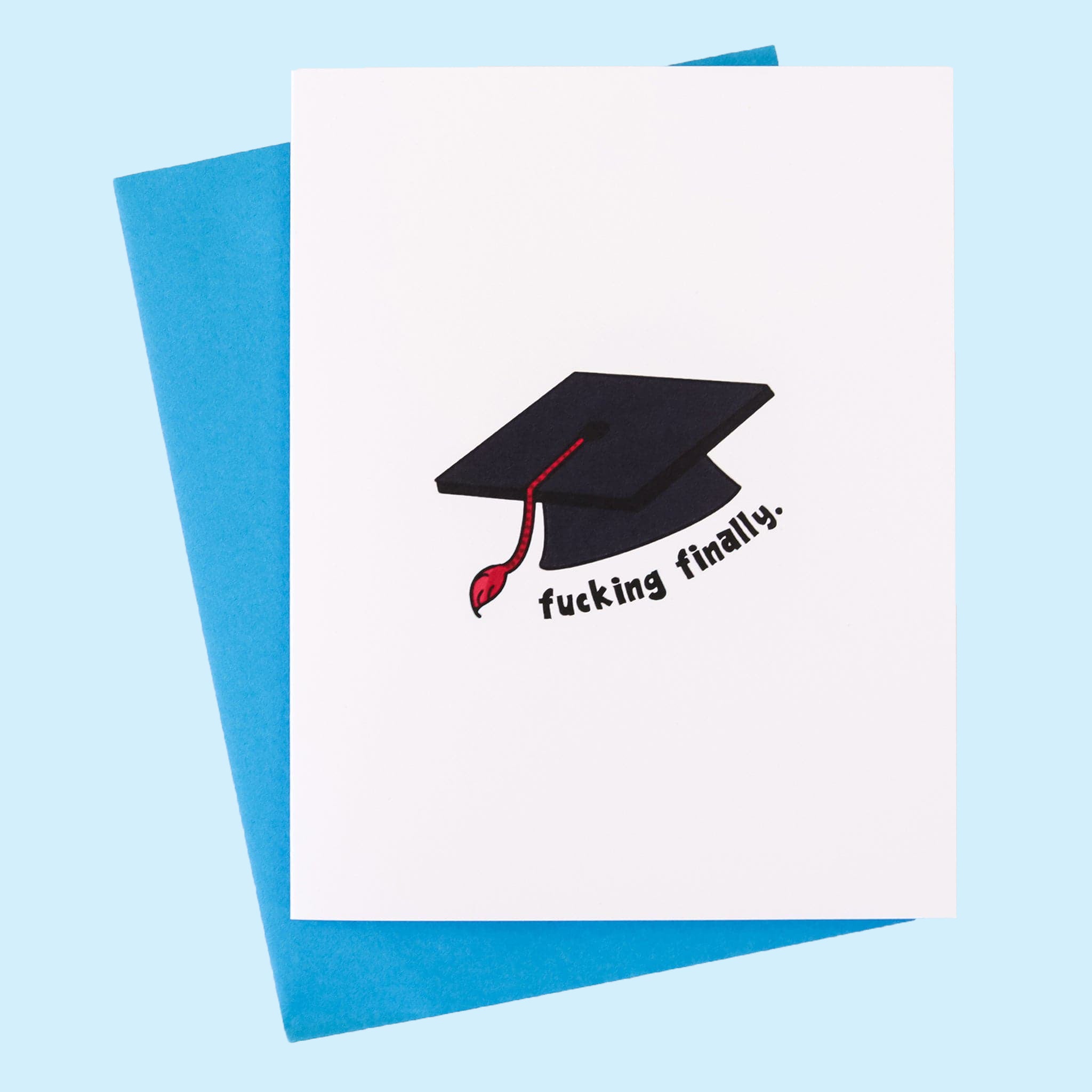 A white card with a graphic of a black graduation cap and text underneath that says, &quot;Fucking Finally&quot; along with a blue envelope. 