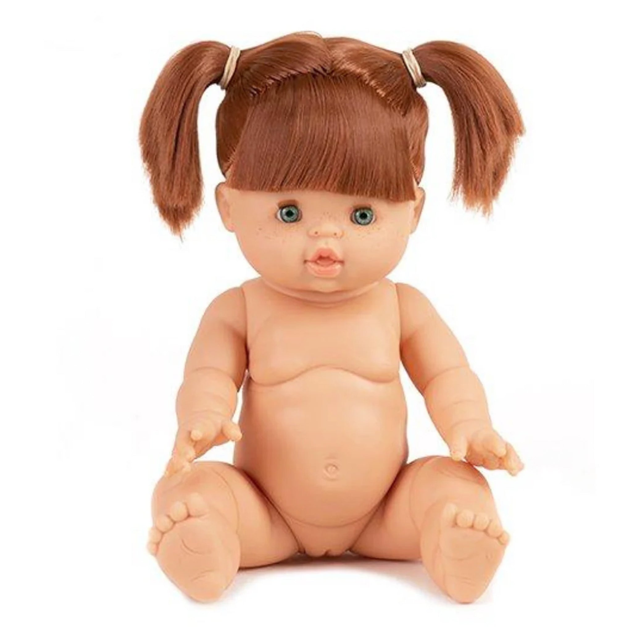 A baby doll with red hair in pigtails, green eyes and freckles. 