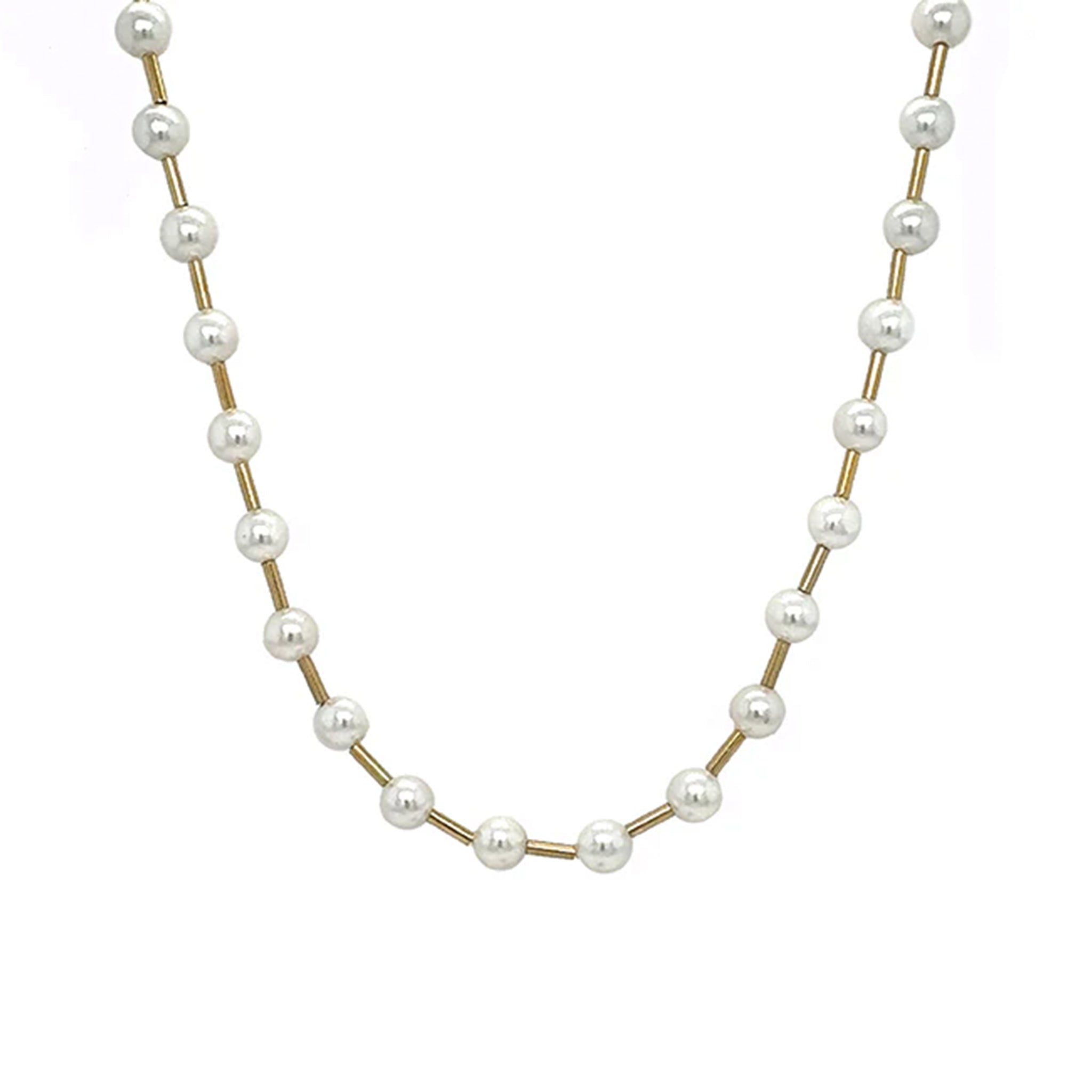 A pearl necklace strung between gold chain. 