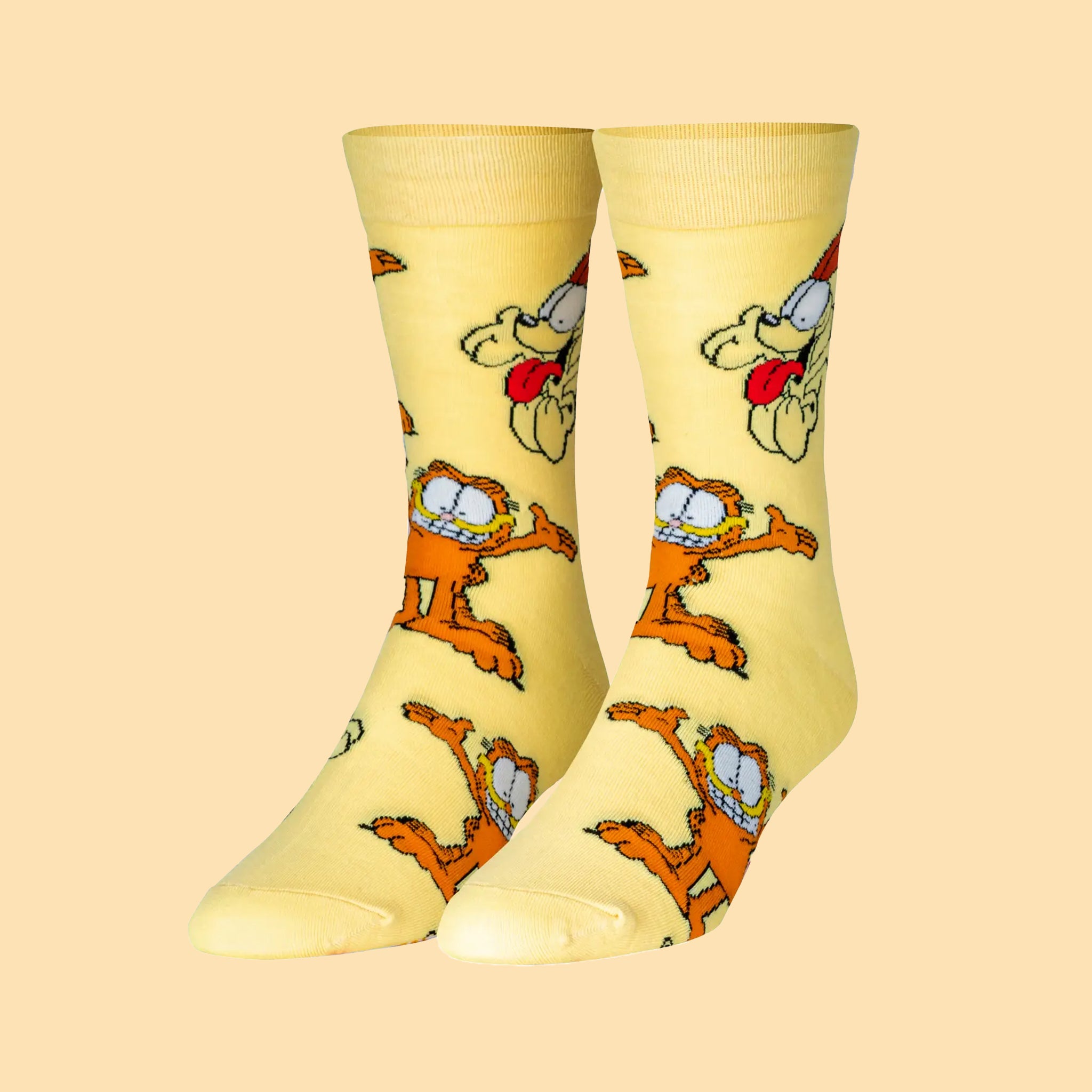 On a yellow background is a yellow pair of socks with a garfield print. 