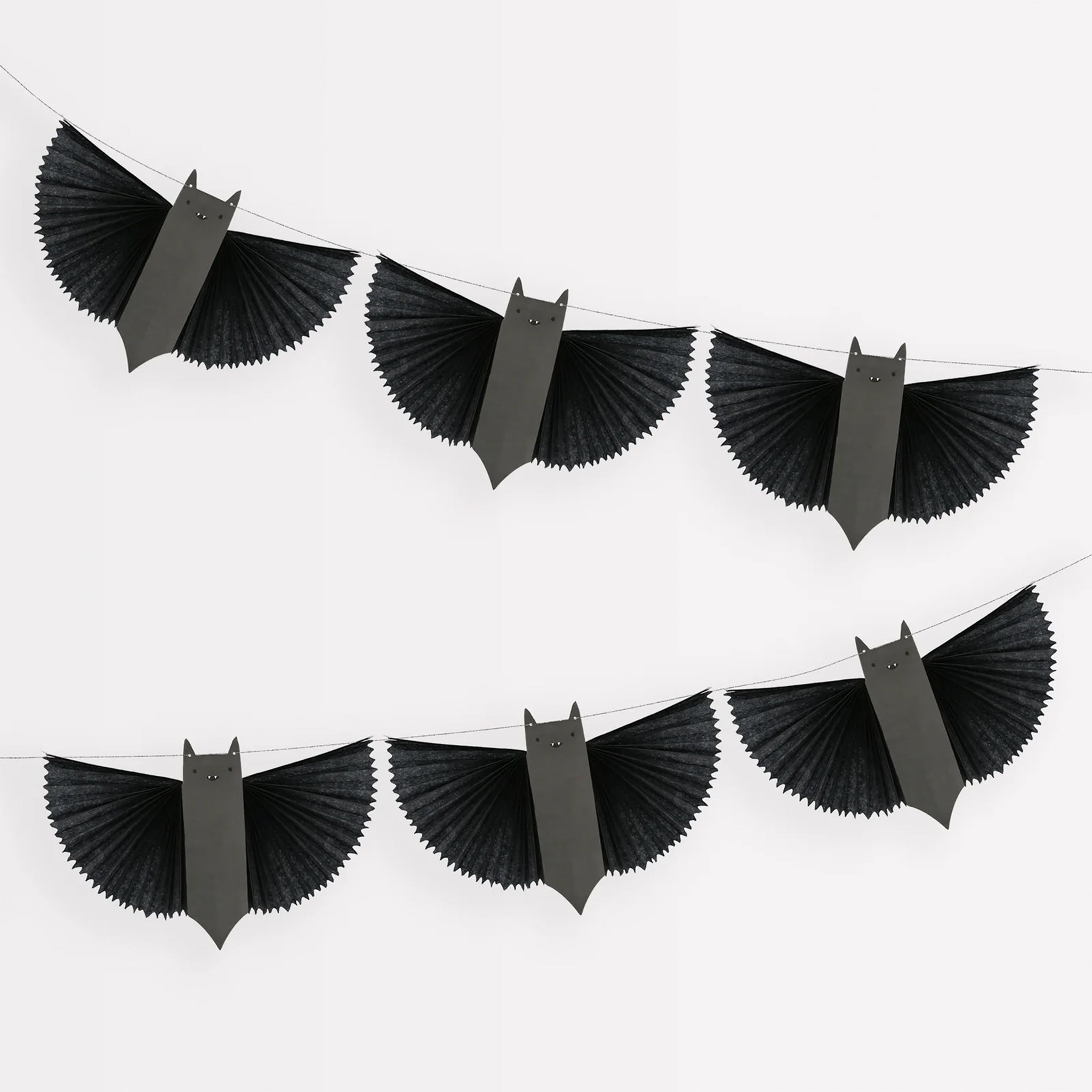 A black and grey paper bat garland.