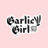 A black and white sticker with text that reads, "Garlic Girl" with a garlic graphic on the side. 