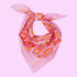 A pinkish-purple and orange bandana with an orange floral print. 