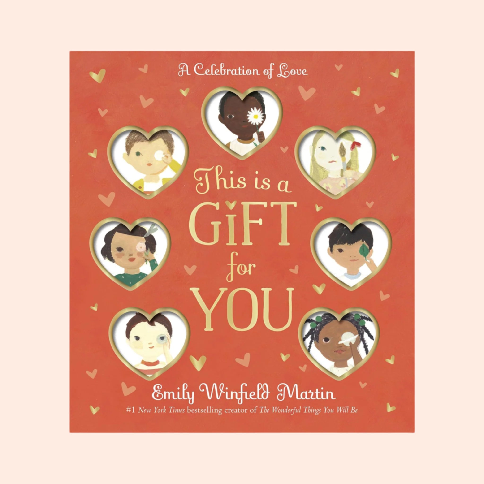 "A Celebration of Love This is a Gift for You Emily Winfield Martin #1 New York Times bestselling creator of The Wonderful Things You Will Be" along with a photo on the book cover with heart shaped cutouts and little boys and girl illustrations behind each one. 