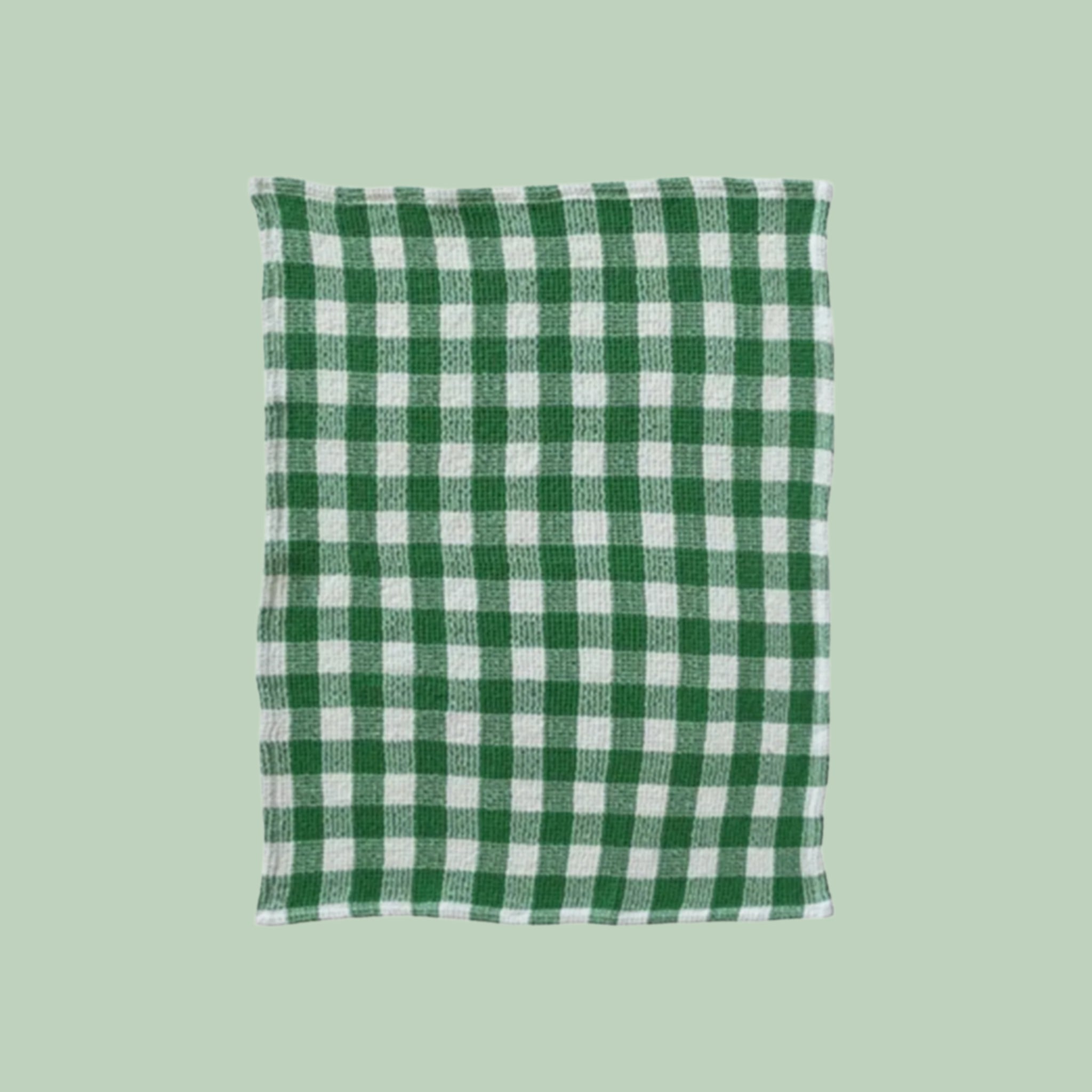 A dark green and white gingham print tea towel. 