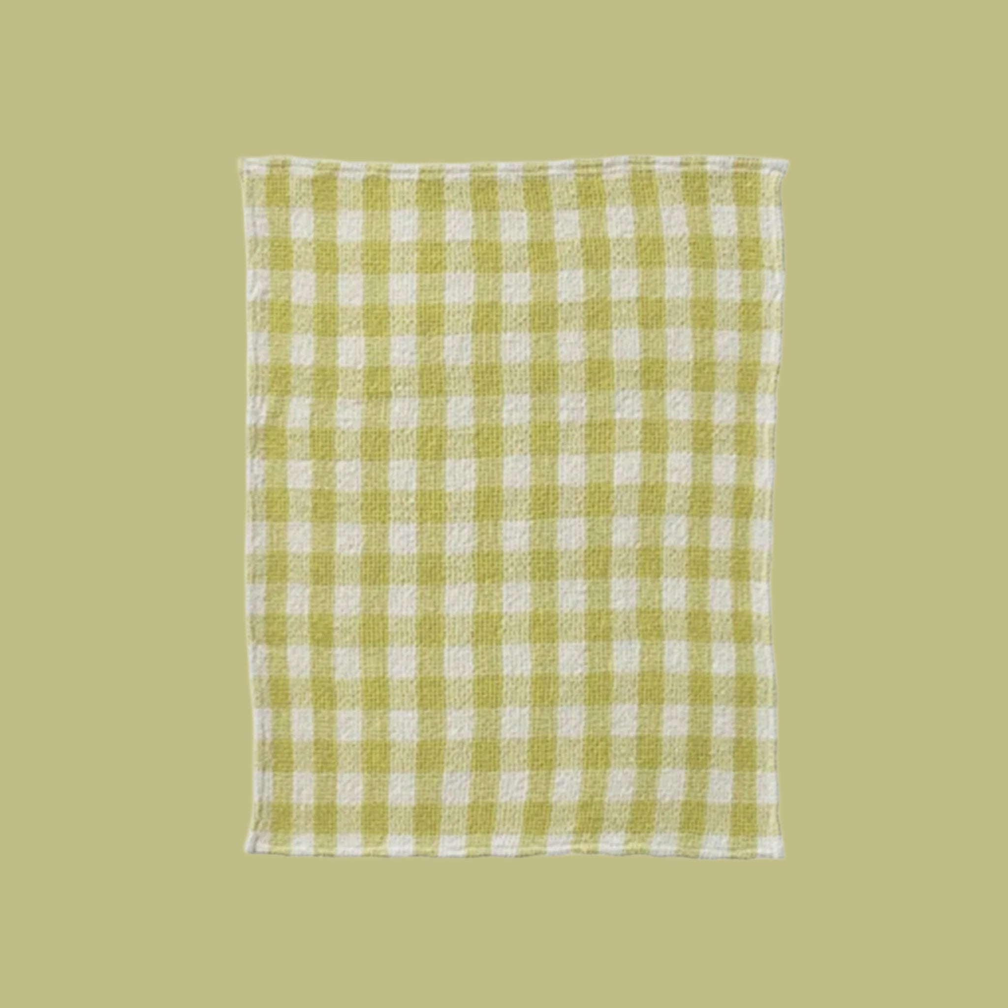 A lime green and white tea towel. 