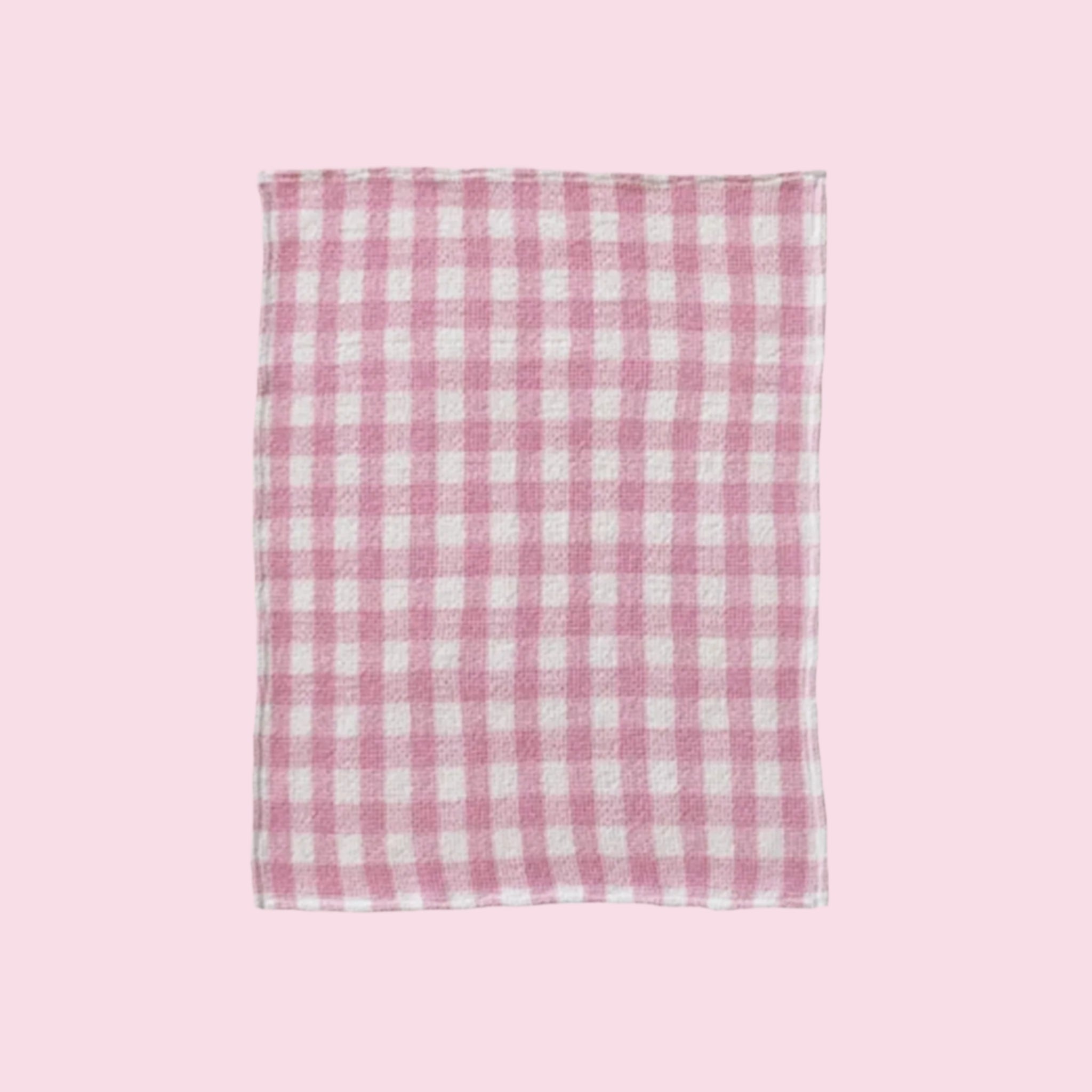 A pink and white gingham print tea towel. 