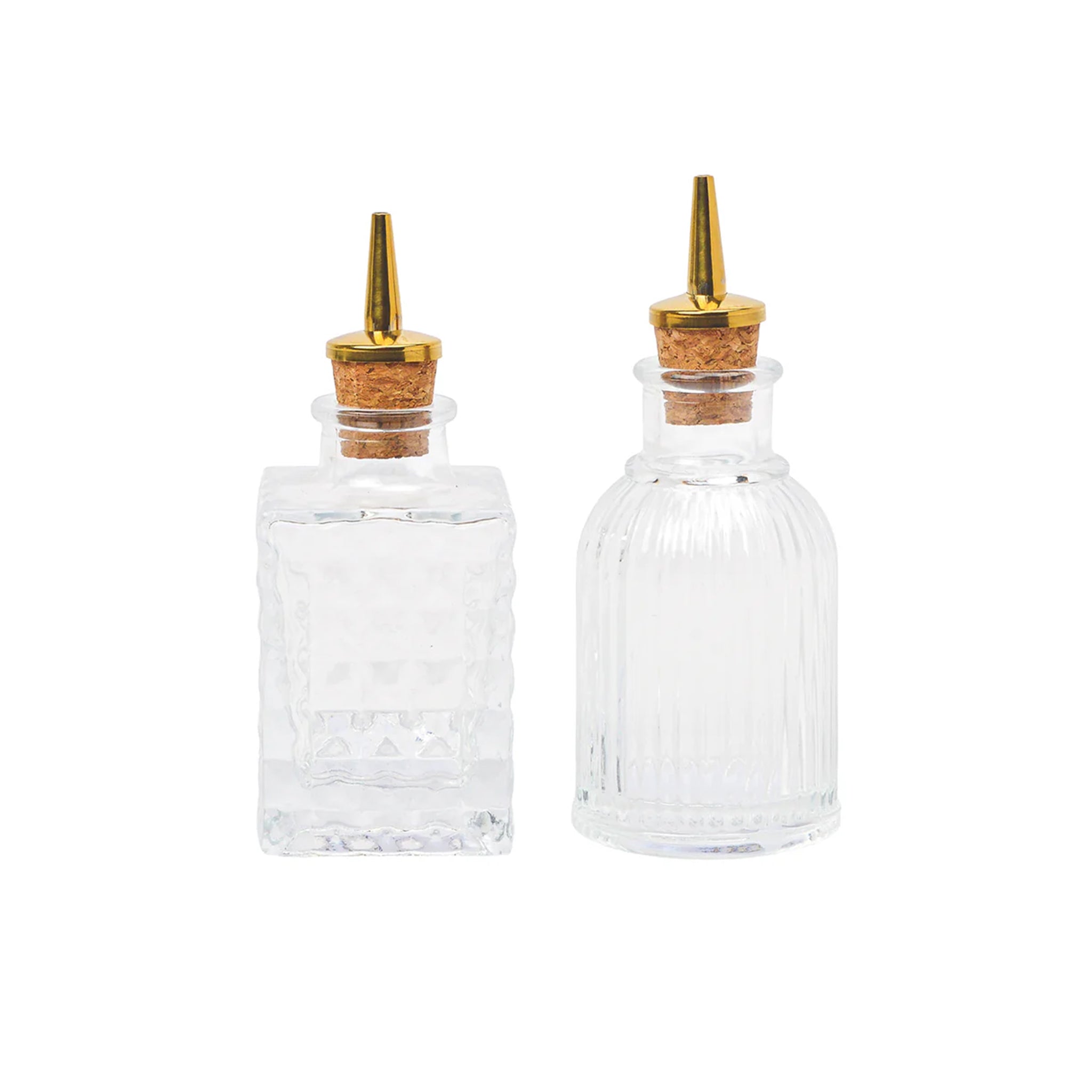 Two glass bitters bottles with gold spouts.