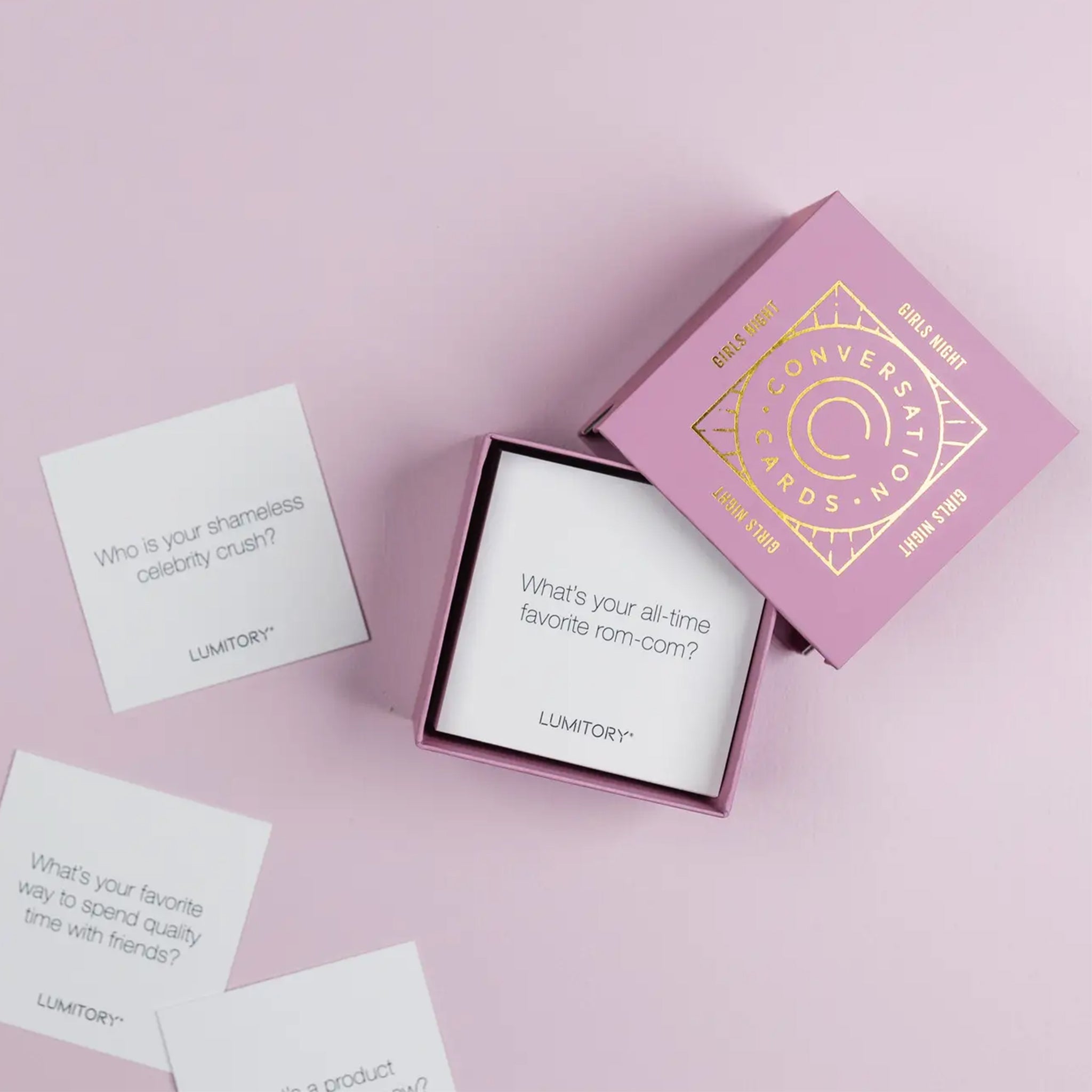 A pink box of conversation cards geared towards girls nights. 