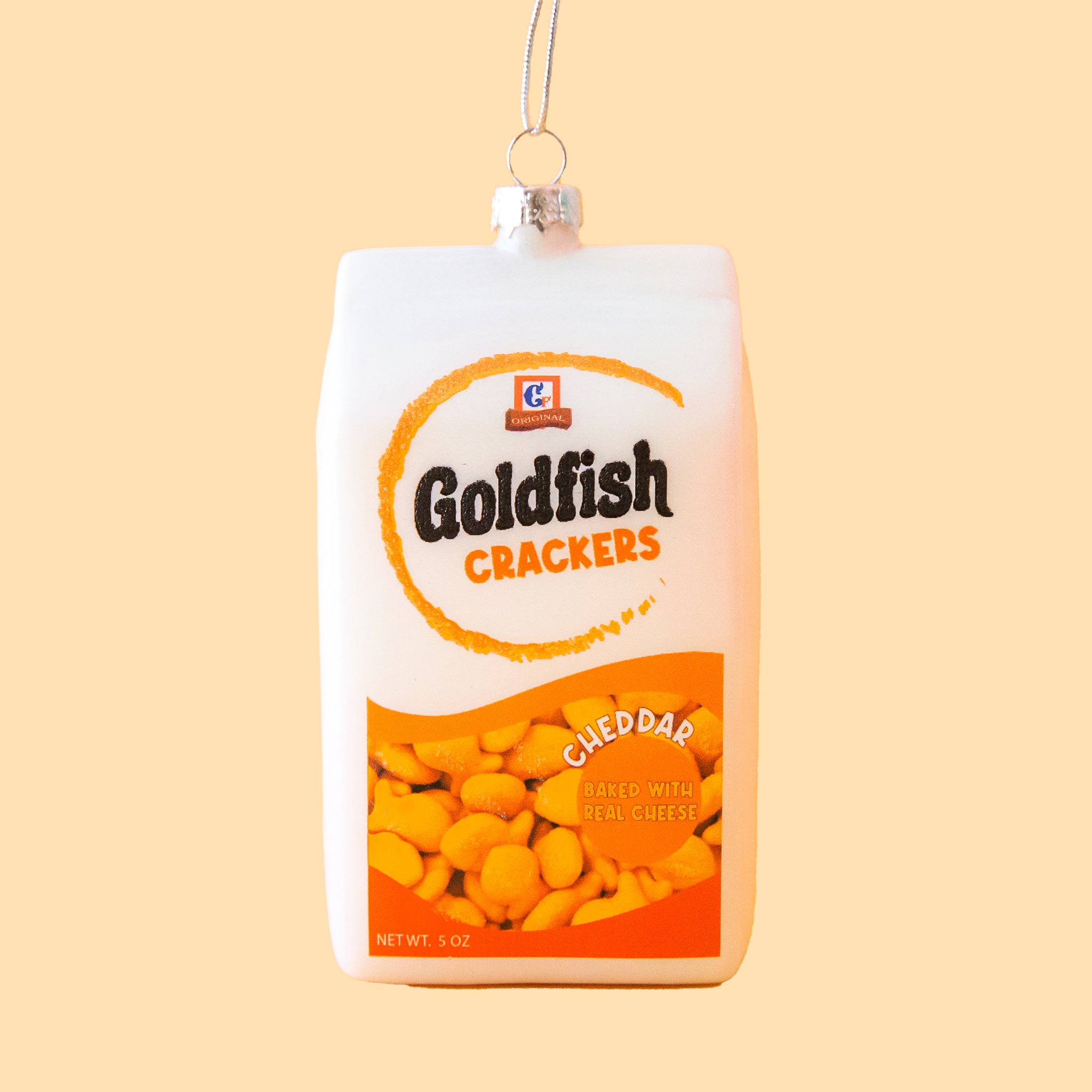 A white goldfish cracker package shaped ornament. 