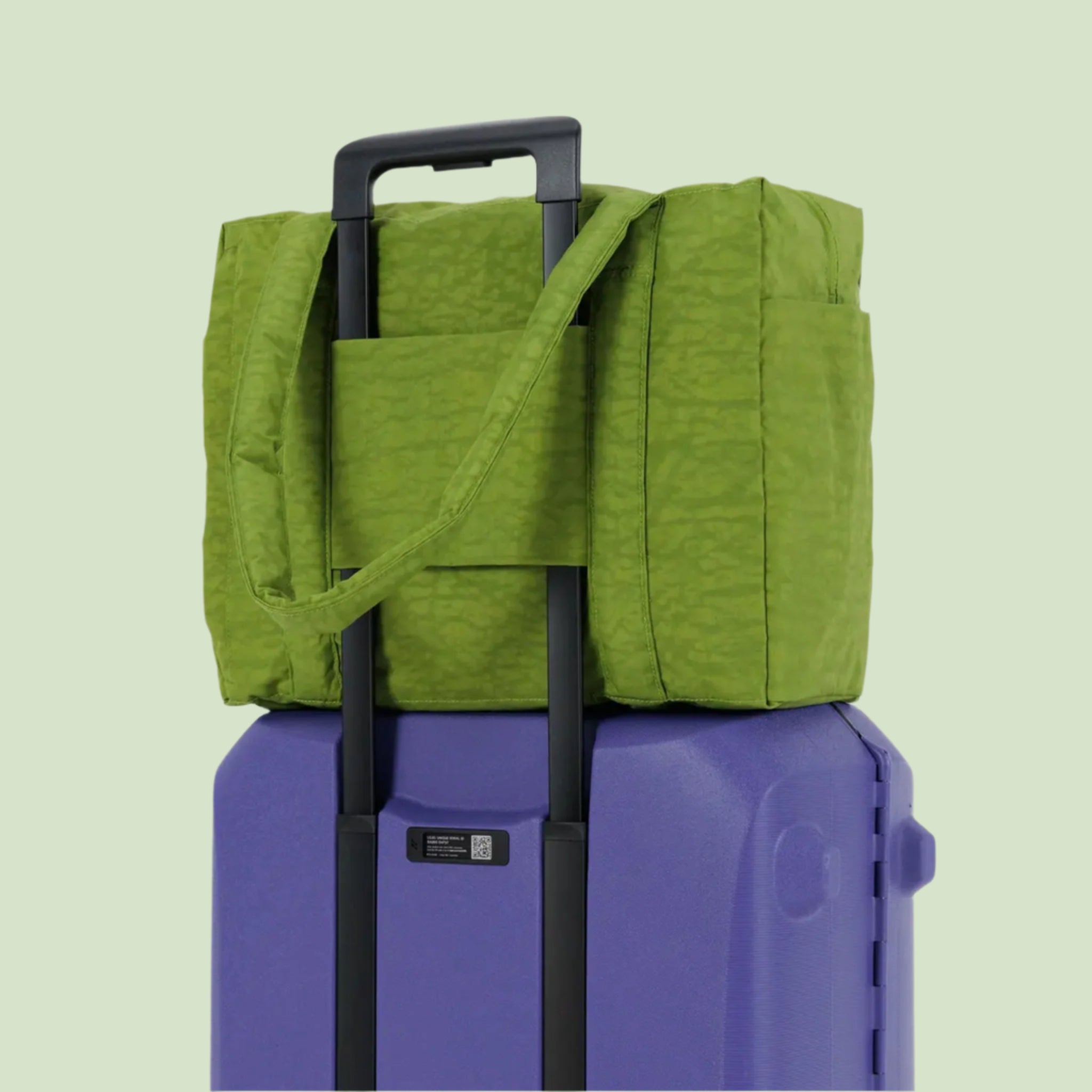 A green puffer carry on tote bag. 