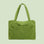 A vibrant green puffer tote bag. 